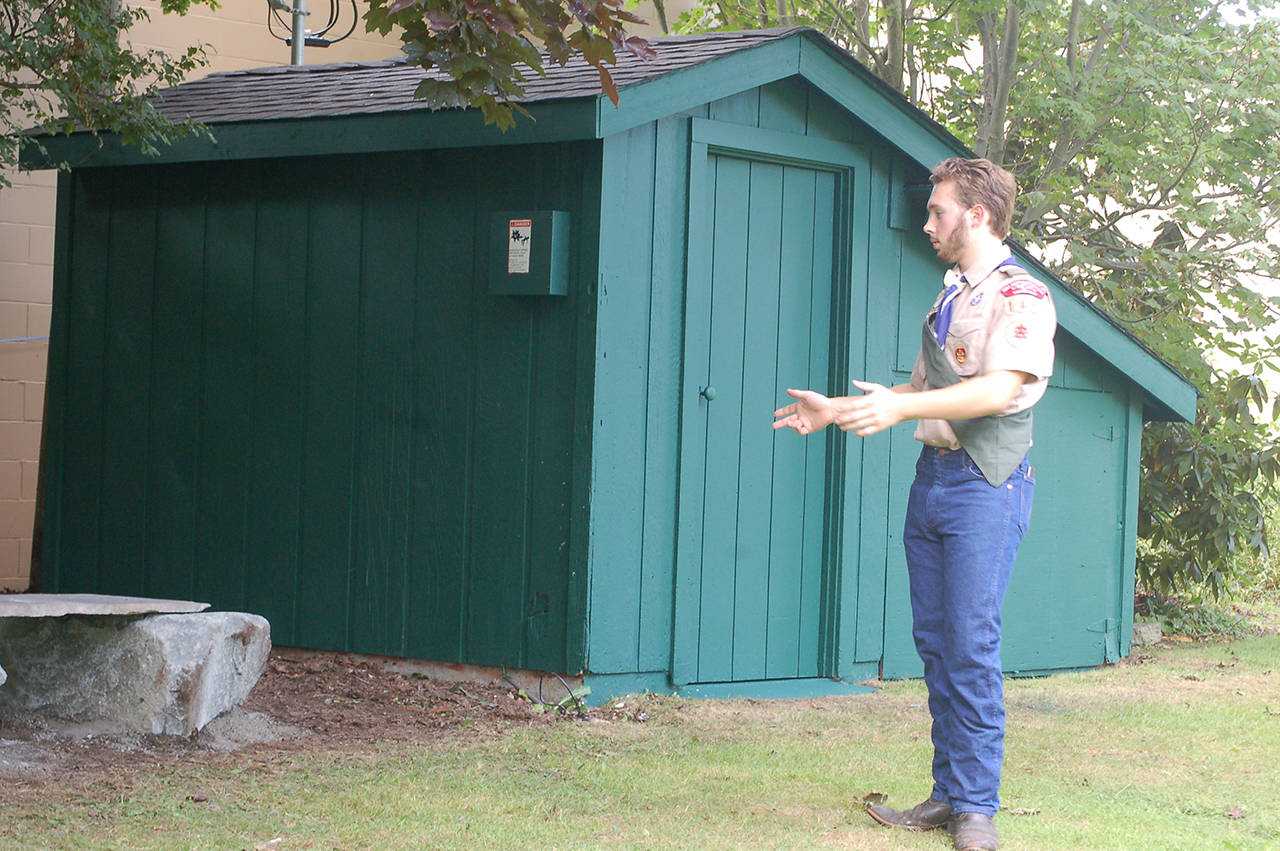Ian Thill describes the work done to restore and enhance a storage shed at Pioneer Memorial Park for his Eagle Scout project. (Conor Dowley/Olympic Peninsula News Group)