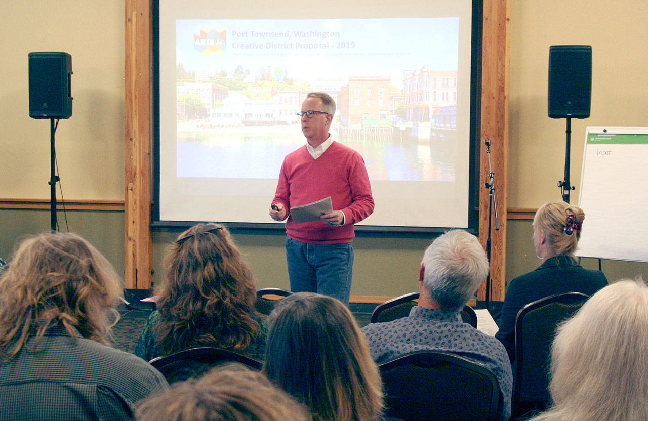 Centrum Executive Director Rob Birman speaks to about 60 people at Fort Worden about the Port Townsend Main Street Association’s effort to apply to become one of the state’s first Creative Districts. (Brian McLean/Peninsula Daily News)
