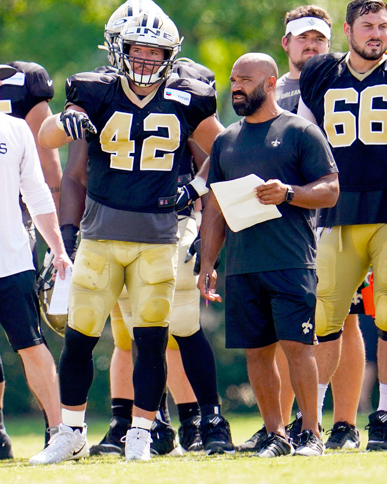 Joel Thomas, right, discusses a play during practice with New Orleans Saints’ fullback Zach Line. Thomas a 1992 Port Angeles High School graduate, is in his fifth season as running backs coach for the Saints. Michael C. Hebert/New Orleans Saints