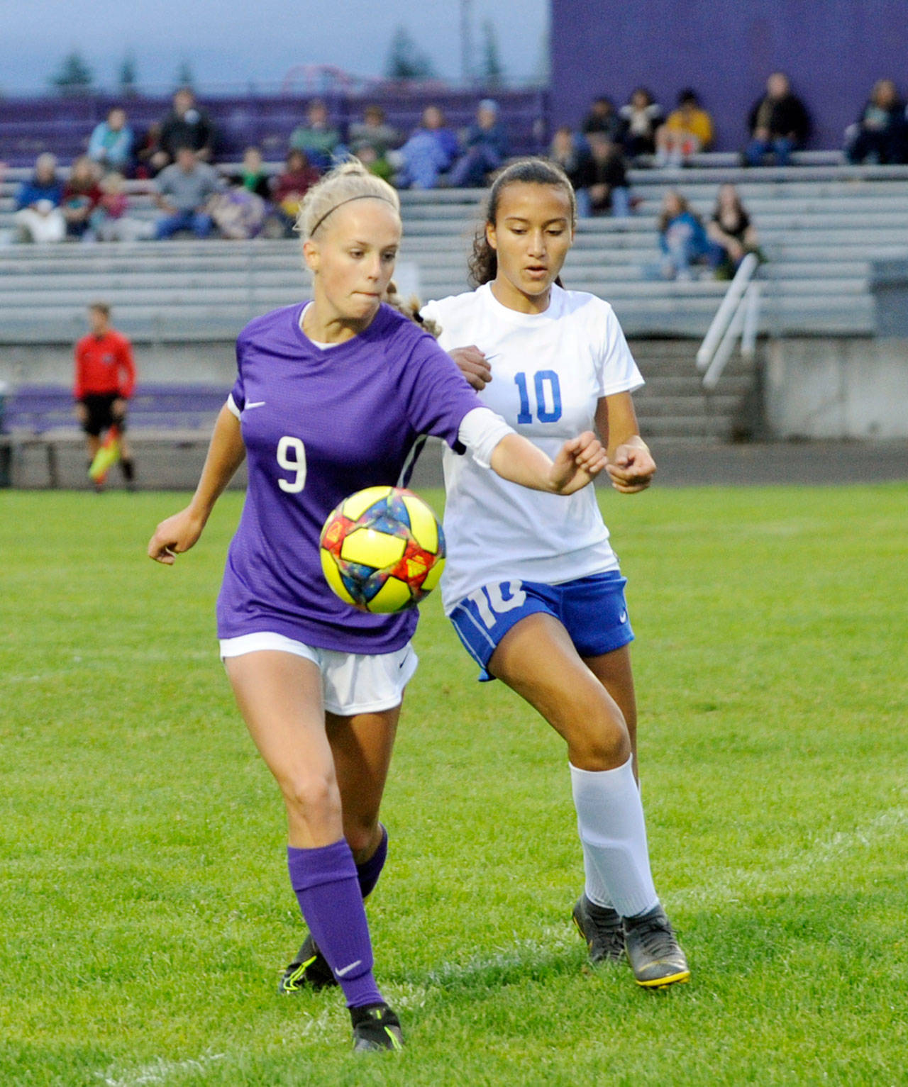 Michael Dashiell/Olympic Peninsula News Group Sequim’s Eden Johnson, left, vies for the ball with a Bremerton defender in an Olympic League match Tuesday. Sequim won, 4-1.