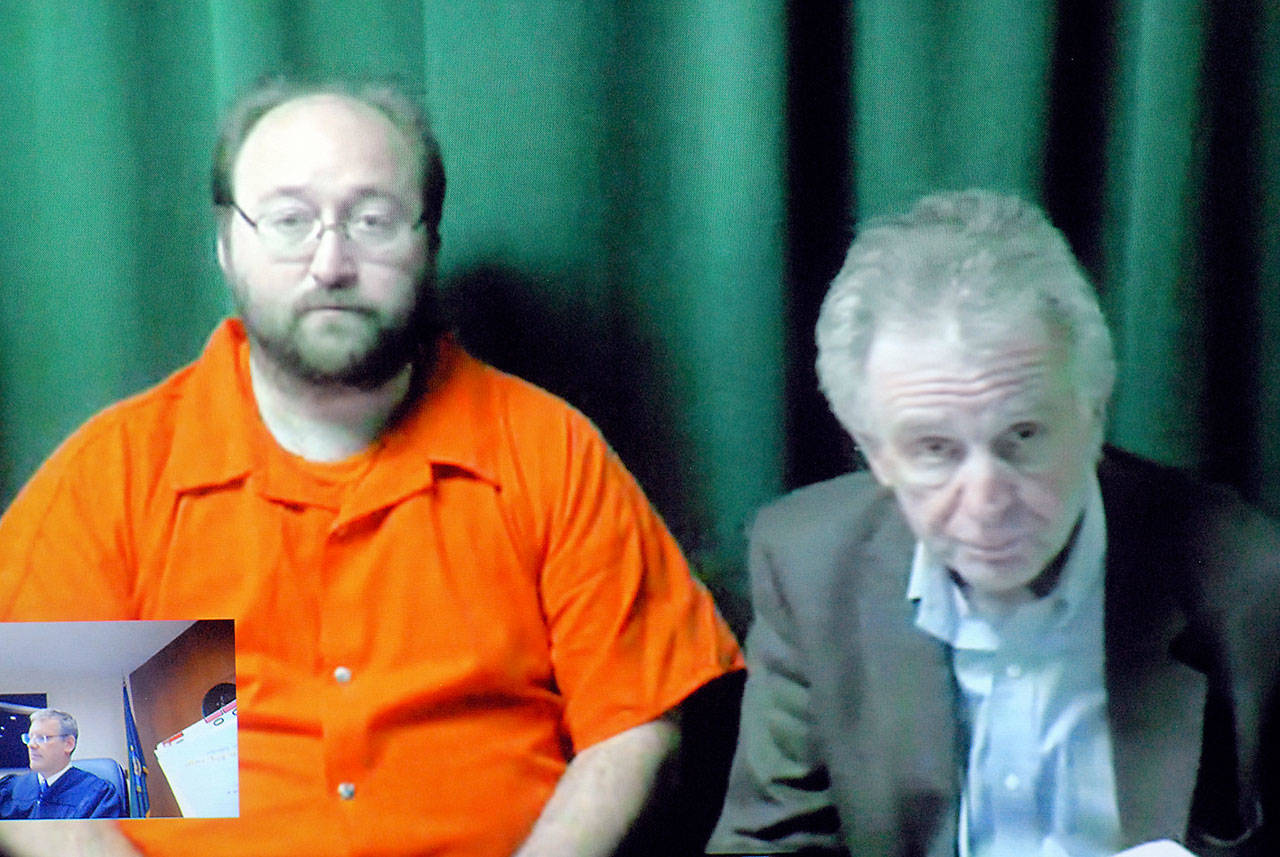 Bryon Midkiff of Port Angeles, 42, left, appears with attorney John Hayden by video link in Clallam County Superior Court in Port Angeles. (Keith Thorpe/Peninsula Daily News)