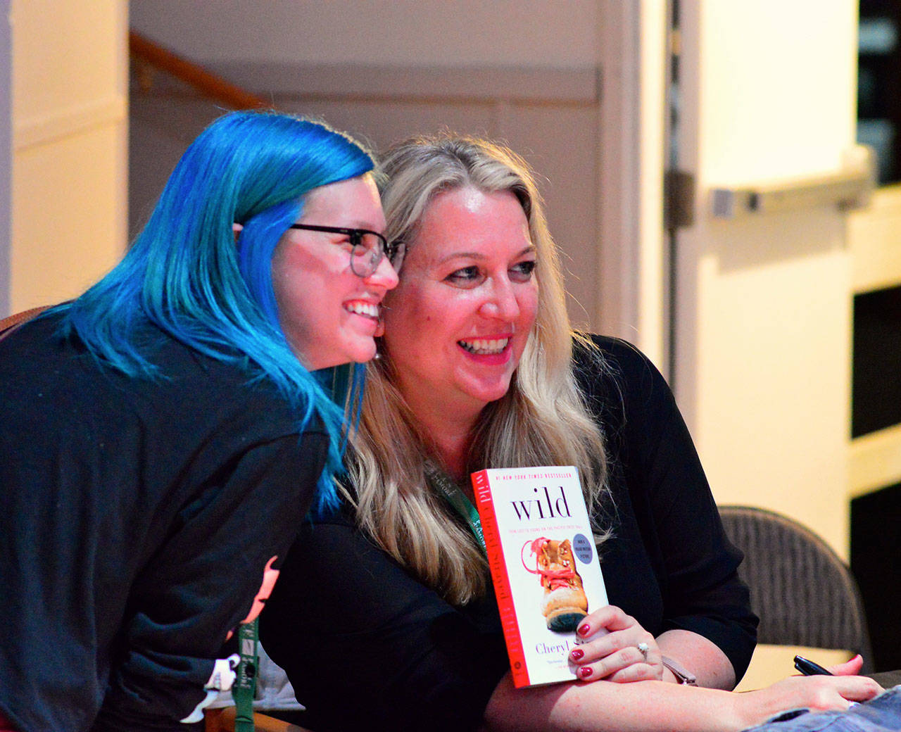 Author Cheryl Strayed signed a fresh copy of her memoir “Wild” for Kym Headley of Port Townsend on Saturday night. Strayed led a discussion of movies, writing and women’s self-determination during the Port Townsend Film Festival throughout the weekend. (Diane Urbani de la Paz/for Peninsula Daily News)