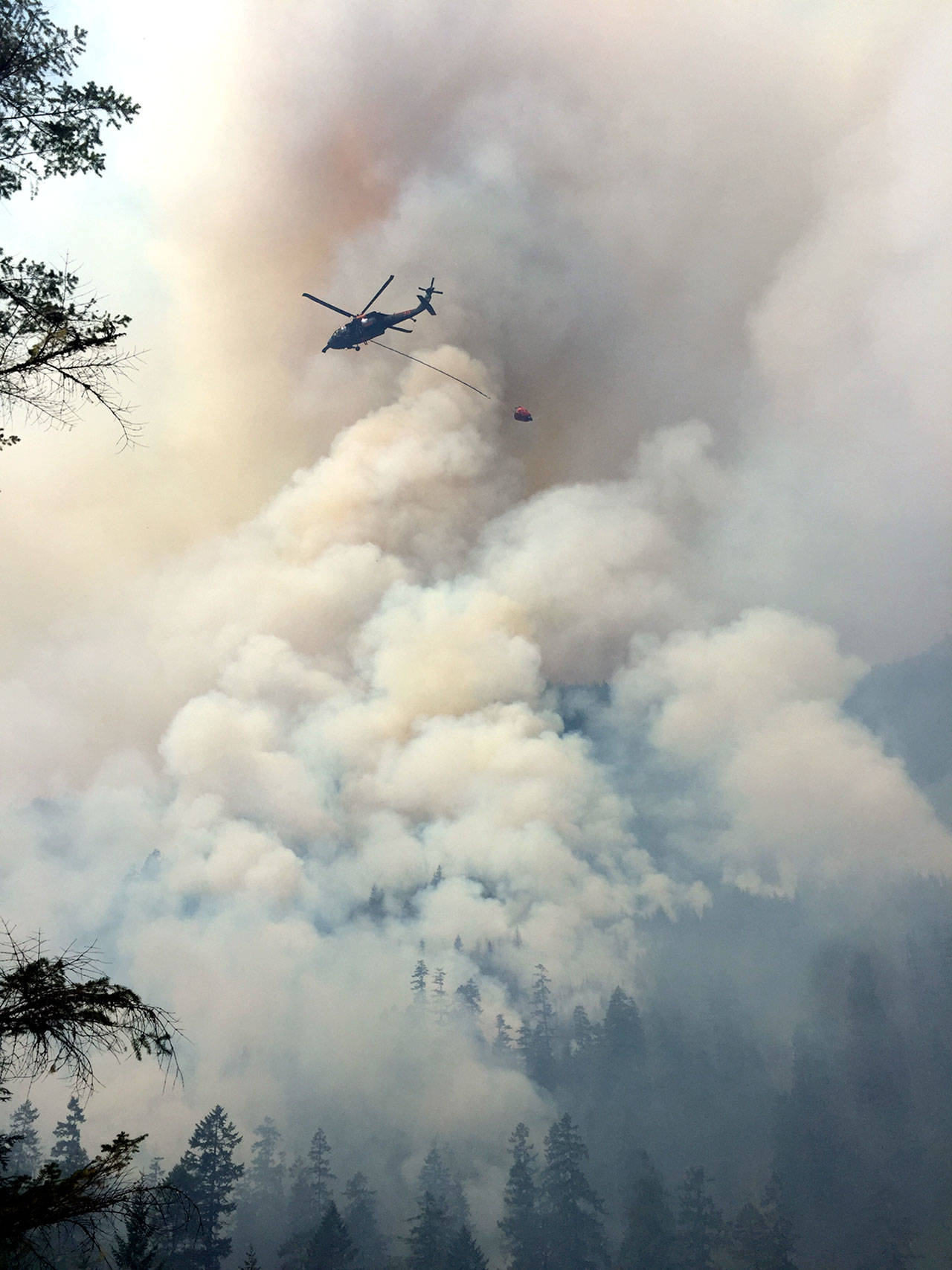 A National Guard helicopter douses the Maple Fire in August 2018. (State Department of Natural Resources)