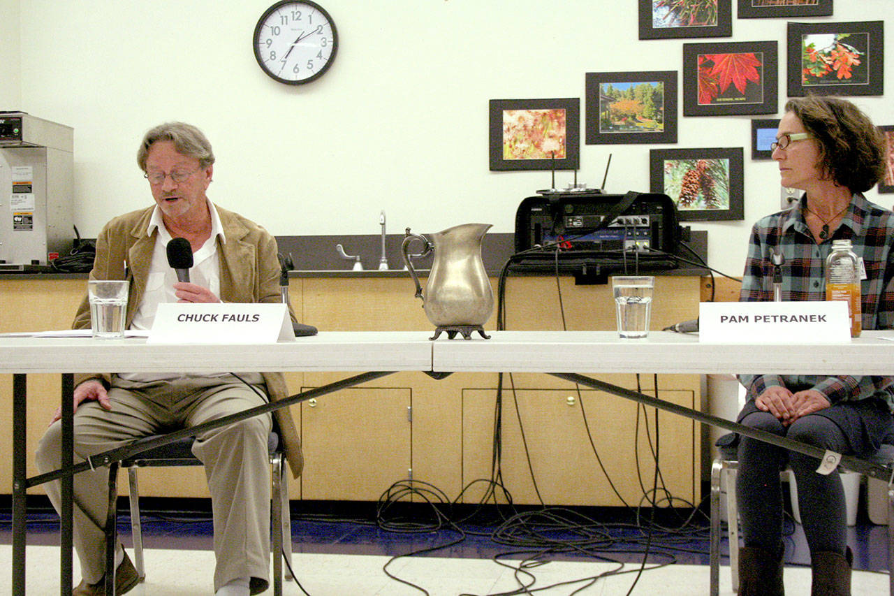 Chuck Fauls, left, and Pam Petranek debate their positions as the candidates on the Nov. 5 general election ballot for Port of Port Townsend commissioner, position 1. The forum, hosted by the Port Townsend chapters of the League of Women Voters and the American Association of University Women, was held at the Port Townsend Community Center. (Brian McLean/Peninsula Daily News)