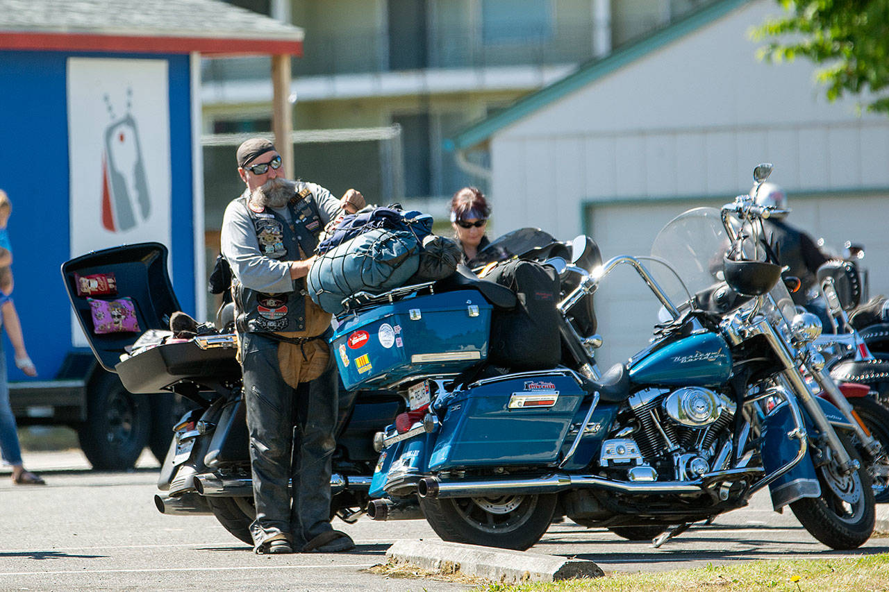 Bob Glaves of Alaska is pictured preparing to ride to Washington, D.C., from Port Angeles on July 21. (Jesse Major/Peninsula Daily News)