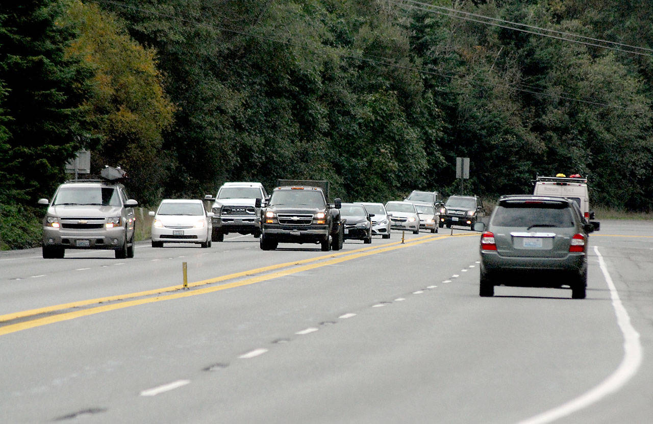 Traffic makes it way on U.S. Highway 101 near Morse Creek east of Port Angeles on Friday. (Keith Thorpe/Peninsula Daily News)