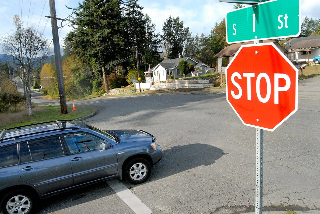 A car approaches the intersection on Eighth and I streets on the west side of Port Angeles on Tuesday. The intersection will be converted into a four-way stop Oct. 14. (Keith Thorpe/Peninsula Daily News)