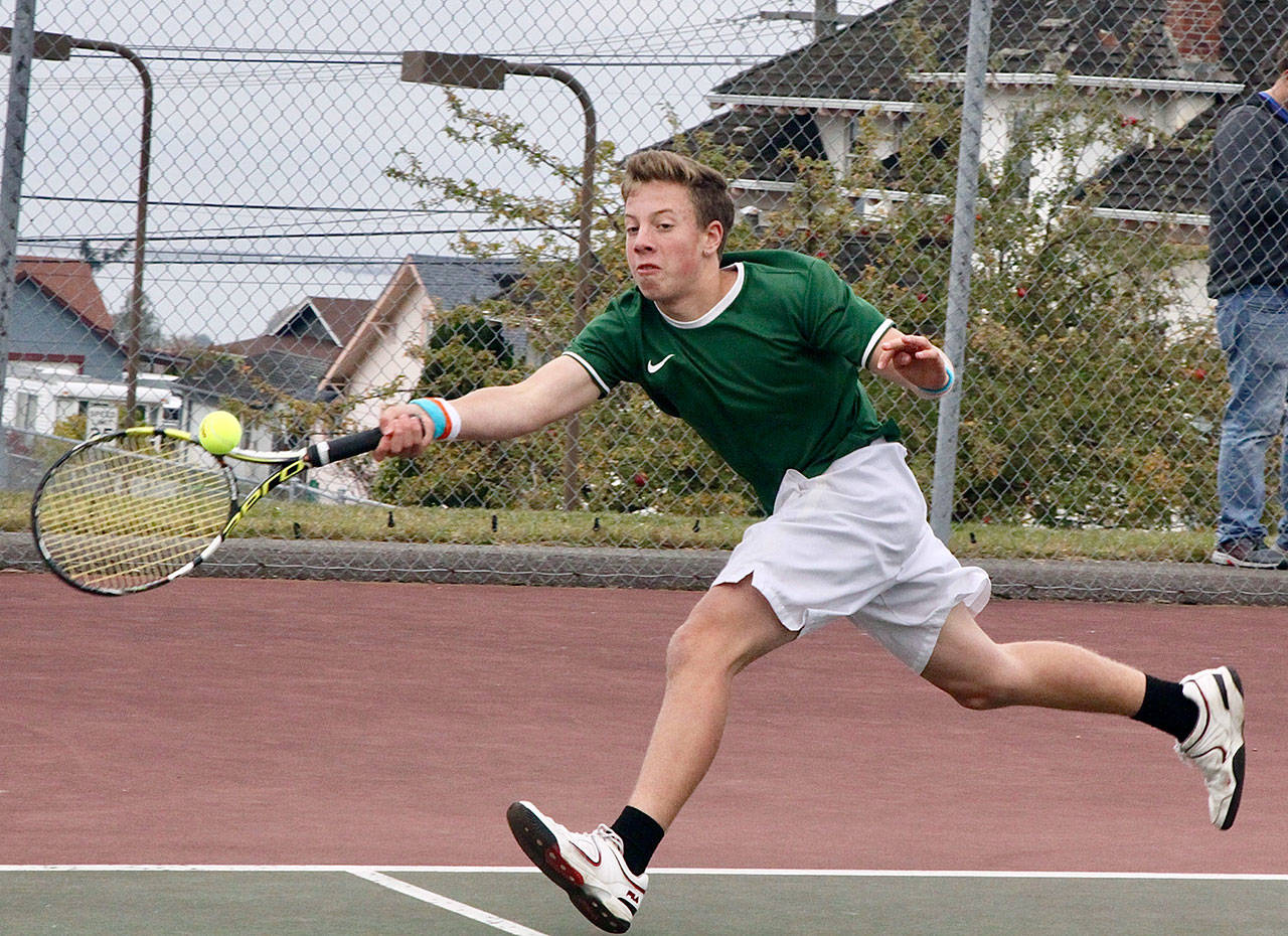 Reef Gelder, a Port Angeles High School freshman, plays the number one match against Olympic on Monday. (Dave Logan/for Peninsula Daily News)