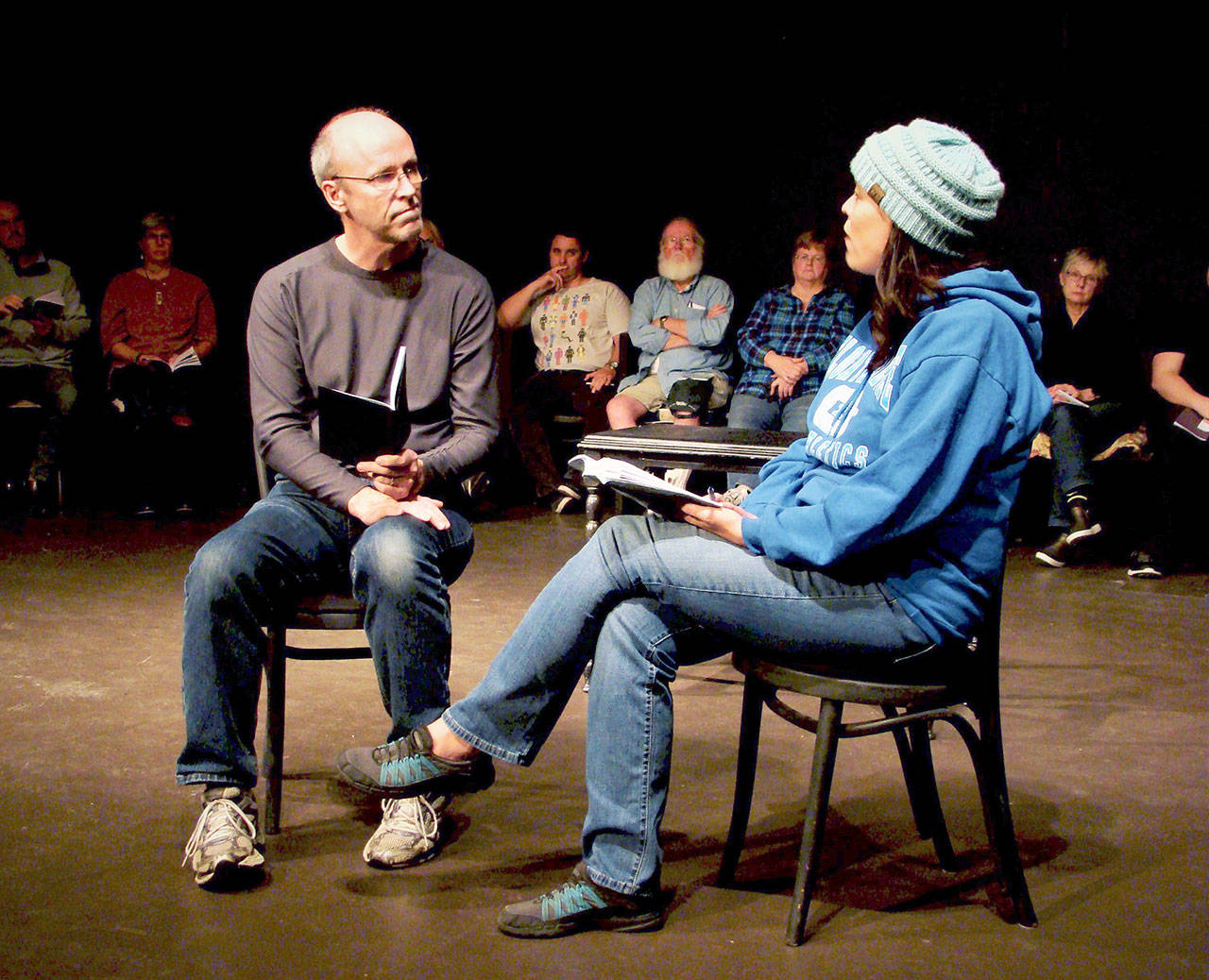 Ken Winters and Kristin Ulsund are in the foreground in this photograph of “The Laramie Project: Ten Years Later.” Visible in the background are, from left, Frank Barevich, Bob Bronsink, Barbara Frederick and Naomi Denhart. (Amy McIntyre)