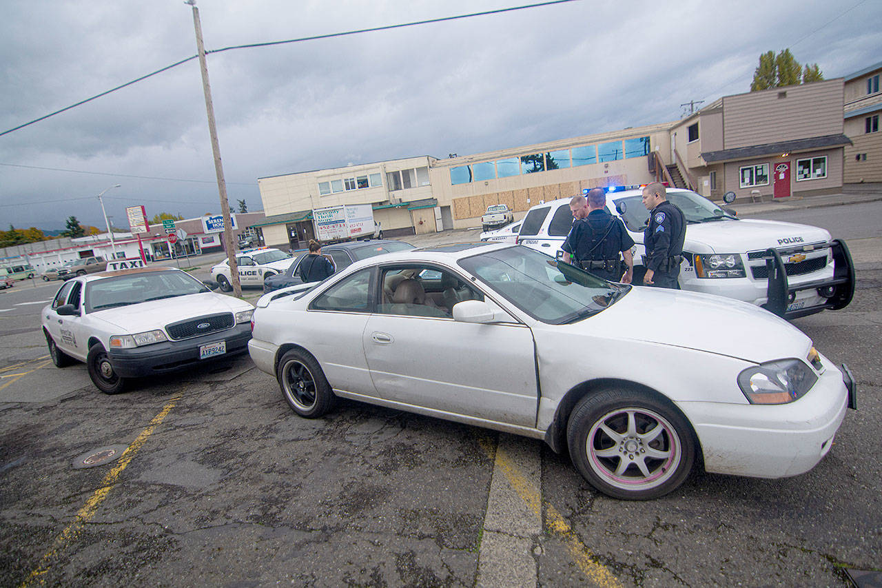 Port Angeles police arrested a man they say assaulted the owner of a gas station and rammed the front of a police vehilce while drunk Thursday afternoon. (Jesse Major/Peninsula Daily News)