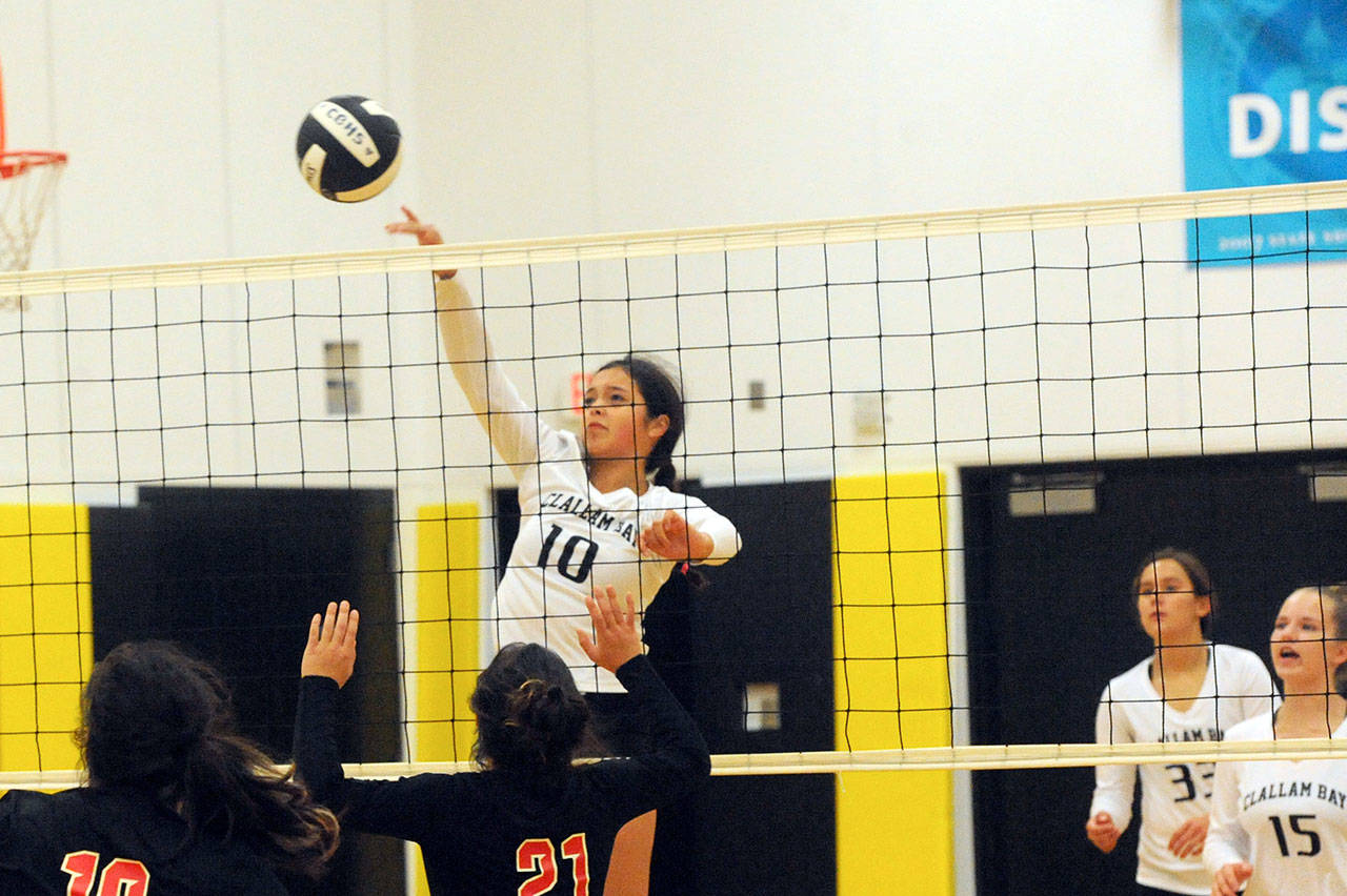 Lonnie Archibald/for Peninsula Daily News Bruin Koren Cumming (10) hits against Chief Kitsap Academy Thursday evening in the Bruin Gym where Clallam Bay defeated Kitsap 3-0 (25-7, 25-10, 25-10) in North Olympic 1B league action. Looking on are Bruins Amber Swan (33) and Rainee Signor (15).