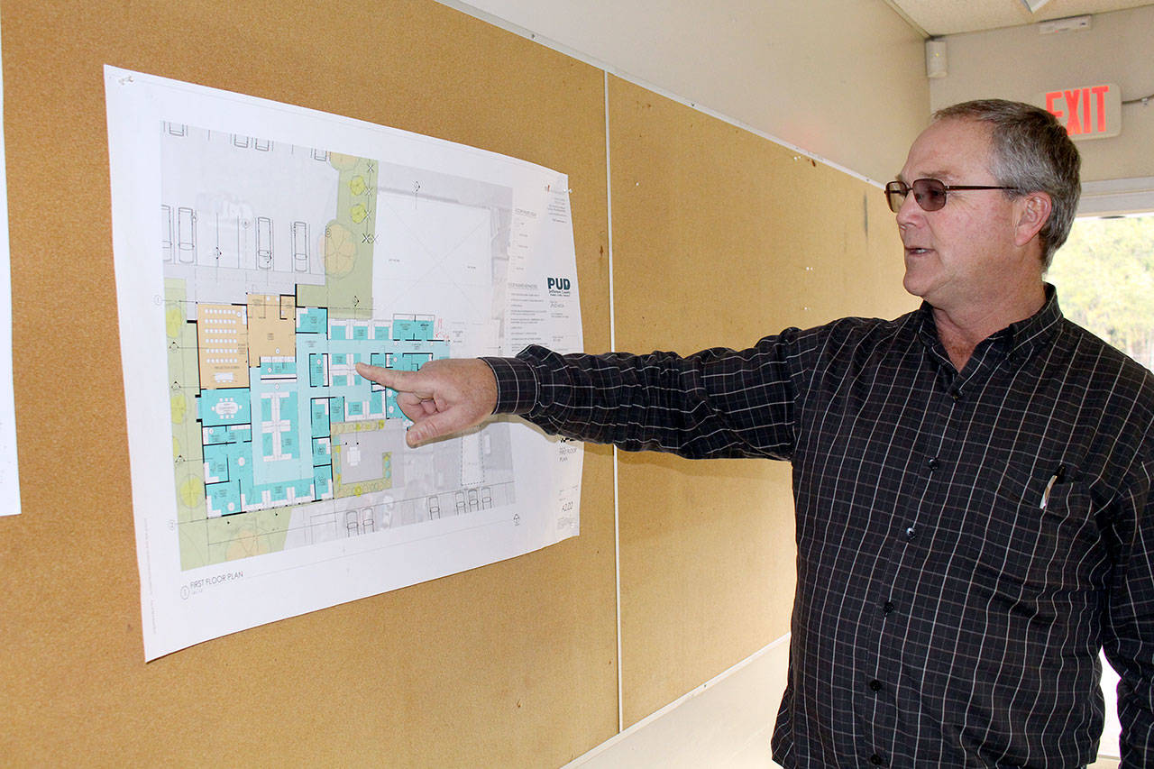 Jefferson Public Utility District General Manager Kevin Streett explains part of the blueprint for the PUD’s renovation of its main administration building. (Zach Jablonski/Peninsula Daily News)