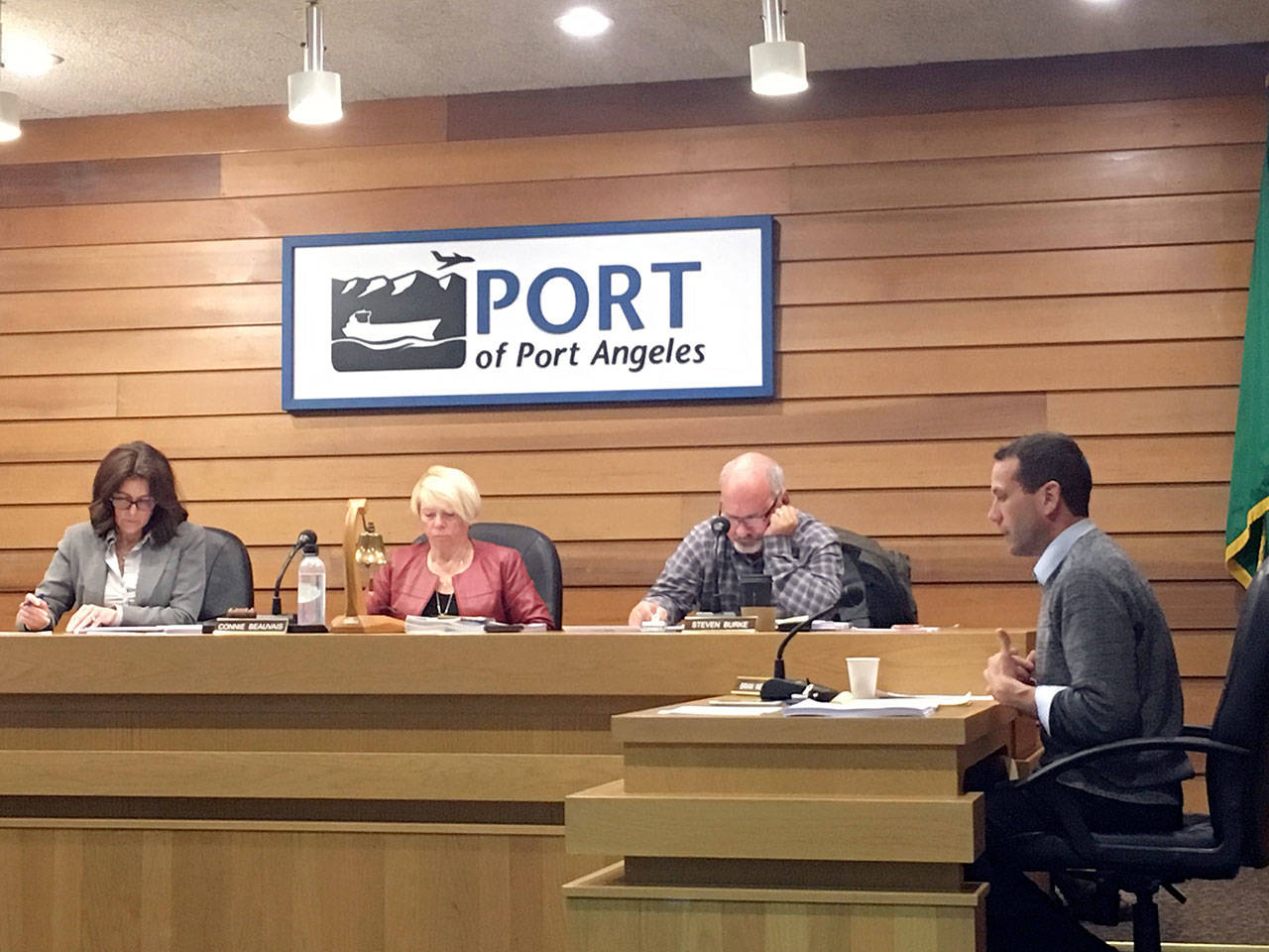 Port of Port Angeles attorney Brian Wendt, right, explains a settlement agreement with Shell Oil that commissioners Colleen McAleer, left, Connie Beauvais and Steve Burke approved unanimously at Tuesdays port commission meeting in Port Angeles. (Rob Ollikainen/Peninsula Daily News)