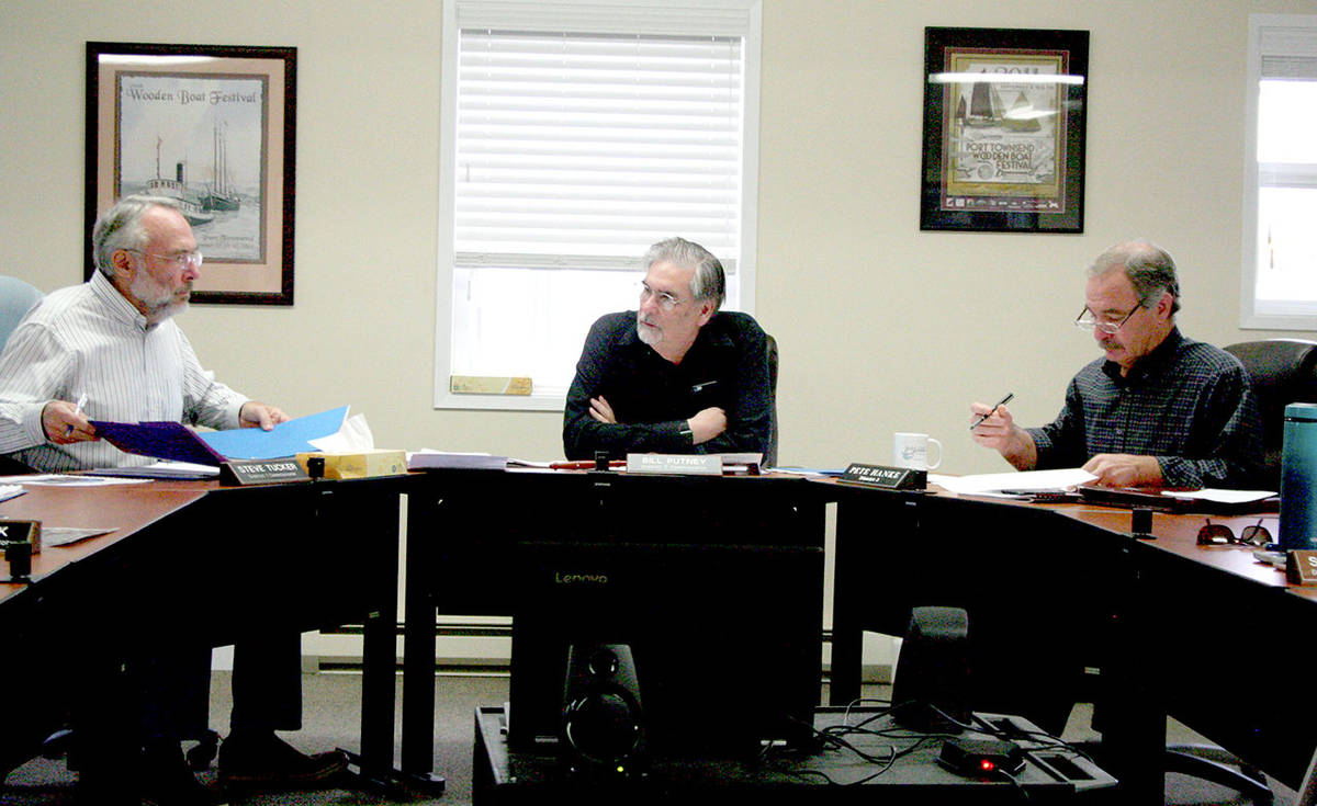 From left, Port of Port Townsend Commissioners Steve Tucker, Chair Bill Putney and Pete Hanke deliberate the 2020 operating and capital budget before unanimously approving it Wednesday morning. (Brian McLean/Peninsula Daily News)