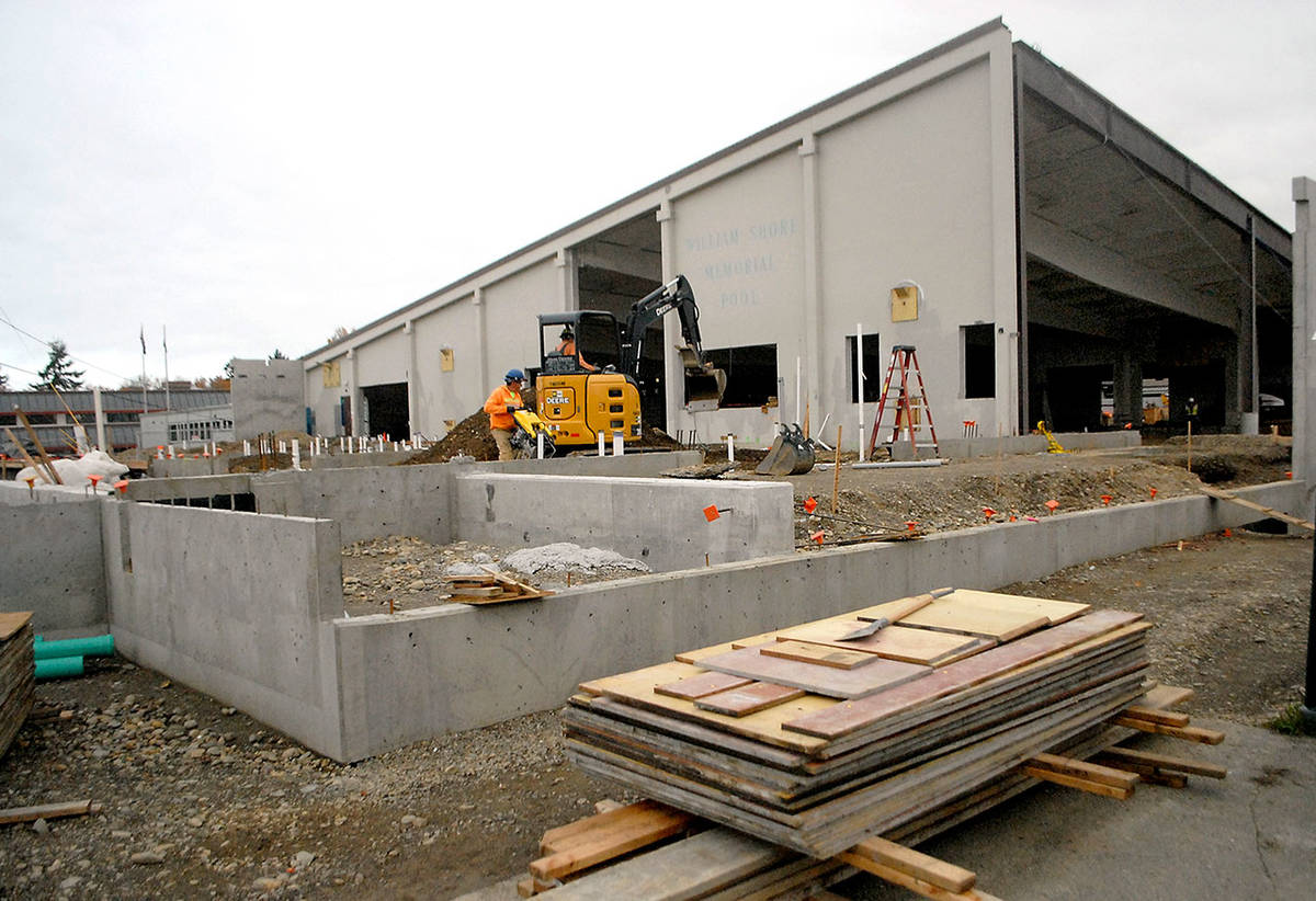 A foundation crew works at the site of the Shore Aquatic Center in Port Angeles. (Keith Thorpe/Peninsula Daily News)