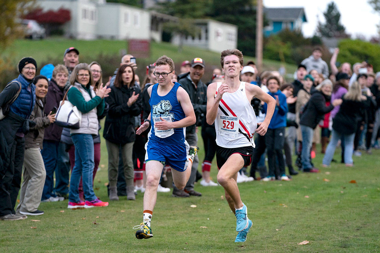 Steve Mullensky/for Peninsula Daily News Port Townsend’s Nathan Cantrell fired the afterburners with 25 meters to go and edges out Nort Mason’s Noah Hasselbad to win the boys Olympic League Championship on Thursday at the Port Townsend Golf Course.