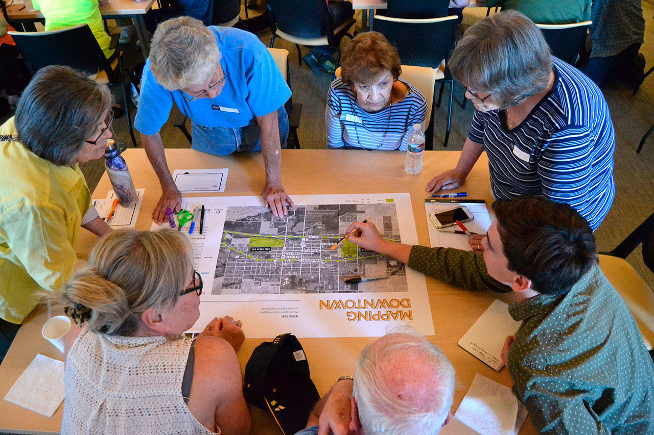 Attendees of a kick-off for the South Sequim Complete Streets Project brainstorm options Aug. 28. Consultants plan to host another open house in 2020 to discuss a possible draft of the project. (Matthew Nash /Olympic Peninsula News Group)