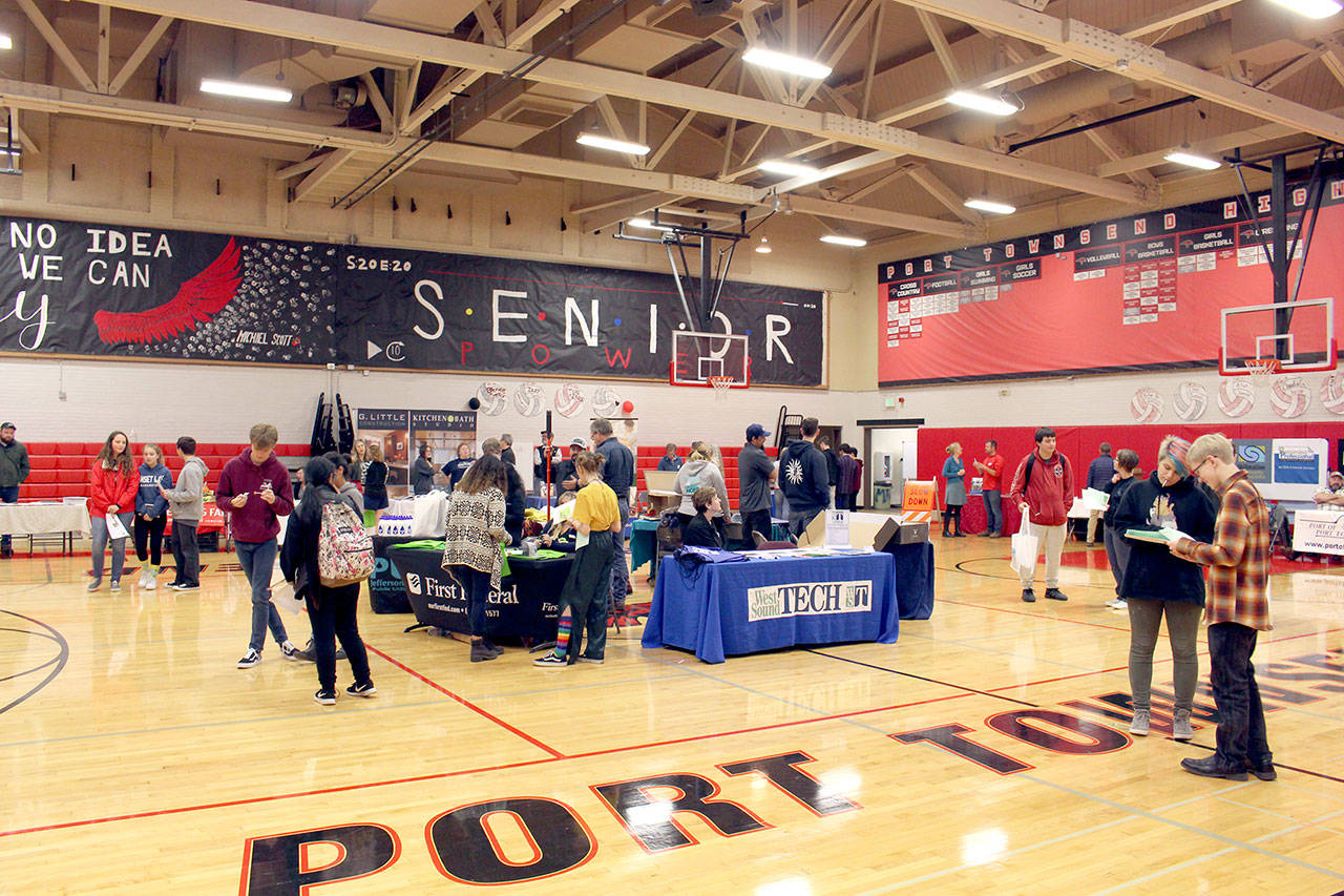 High school students walk through the Port Townsend High School gym during the career fair the school hosted Friday afternoon with 27 employers providing information to students. (Zach Jablonski/Peninsula Daily News)