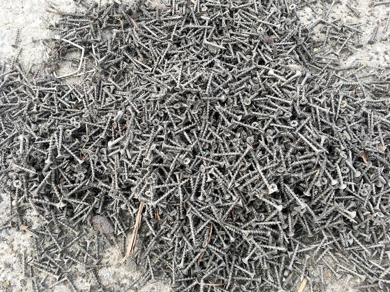 Crews with the state Department of Transportation recovered hundreds of screws from U.S. Highway 101 east of Port Angeles. (State Patrol)
