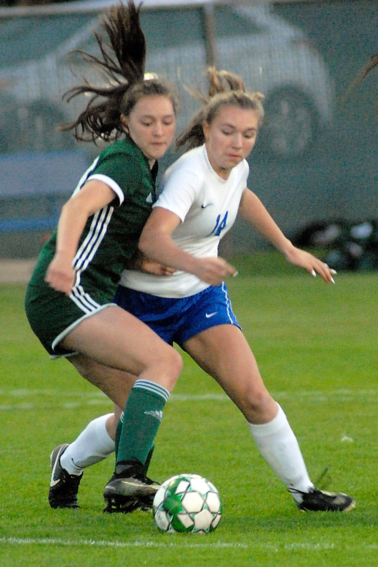 Port Angeles Jada Cargo, left, and Bremertons Claire Warthen battle for control during a game earlier this season at Civic Field. (Keith Thorpe/Peninsula Daily News)
