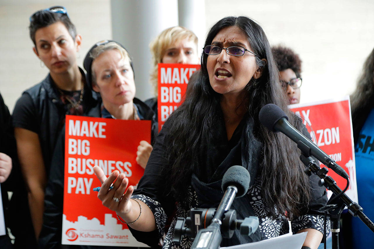 Seattle City Council member Kshama Sawant speaks at City Hall in Seattle on June 12, 2018. Seven of the nine Seattle City Council seats are up for grabs in this month’s election, where retail giant Amazon has made unprecedented donations totaling $1.5 million to a political action committee that’s supporting a slate of candidates perceived to be friendlier to business. Among the company’s top targets is Sawant, a fierce critic of Amazon, who is running against Egan Orion in the District 3 race. (Ted S. Warren/The Associated Press file)