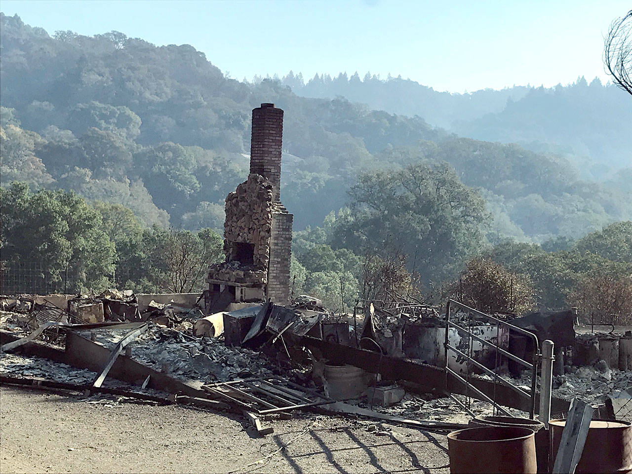 East Jefferson County firefighters are helping to mop up the Kincade Fire as in this photo of the charred shell of a home near Kellogg, Calif., in Sonoma County.