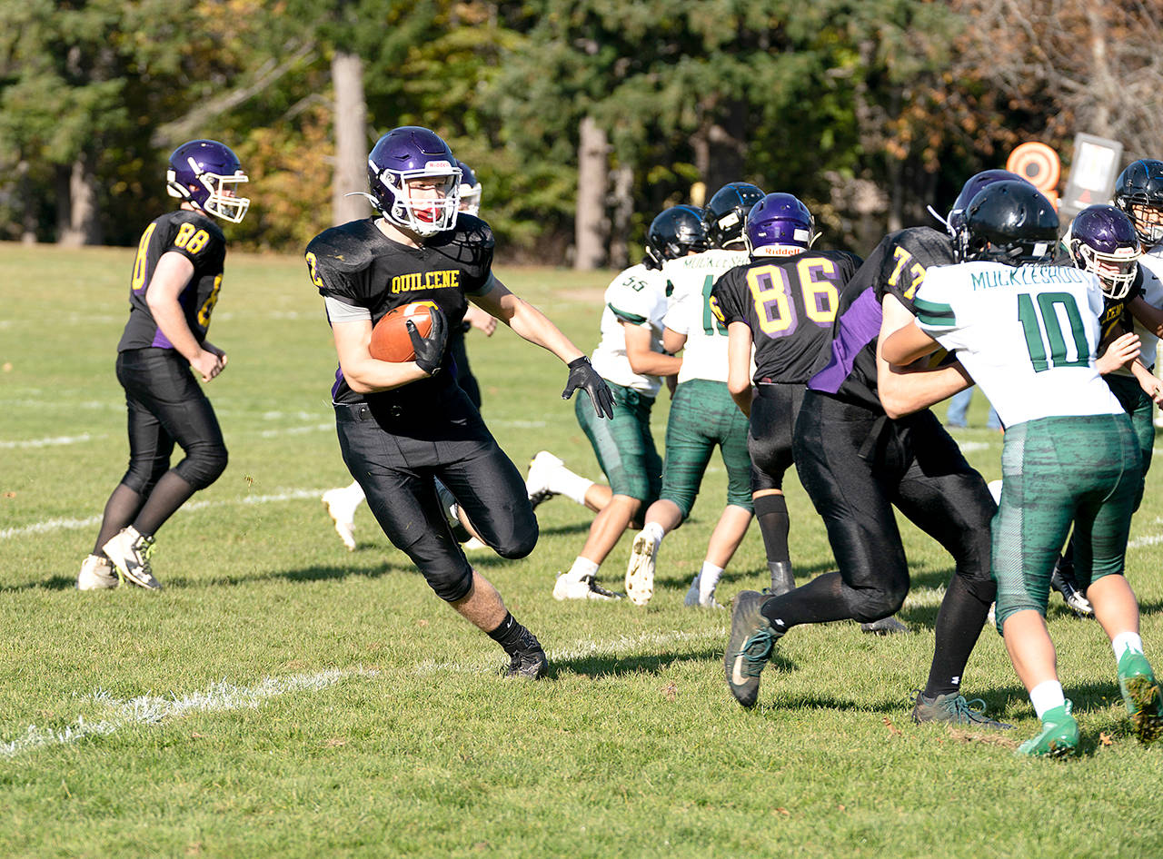 Steve Mullensky/for Peninsula Daily News Quilcene’s Bishop Budnek runs against Muckleshoot on Saturday in the Rangers 58-6 win.