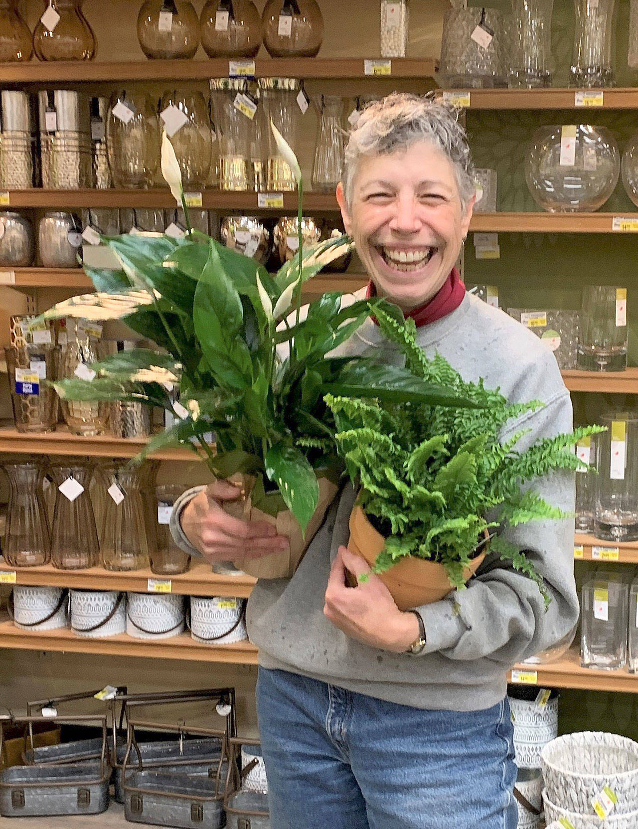 Jeanette Stehr-Green, pictured here in Sequim Safeway where she found an abundant variety of house plants that beat the winter blues, will present at the next Green Thumb Gardening Tips Education Series lecture Thursday. (Betty Harriman)