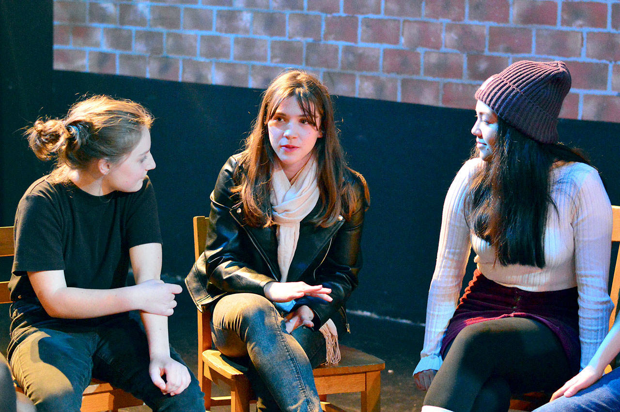 Cast members, from left, Trillium Burbank, 14, Pascale Sanok, 15, and Julia Neville, 16, discuss “Our Town,” the fall play at Port Townsend High School. (Diane Urbani de la Paz)