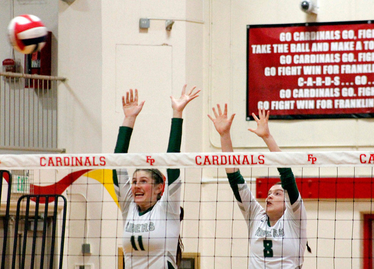 Ava Brenkman and Jaida Wood go up for a block in PA’s opening game against Orting. (Mark Krulish/Kitsap News Group)