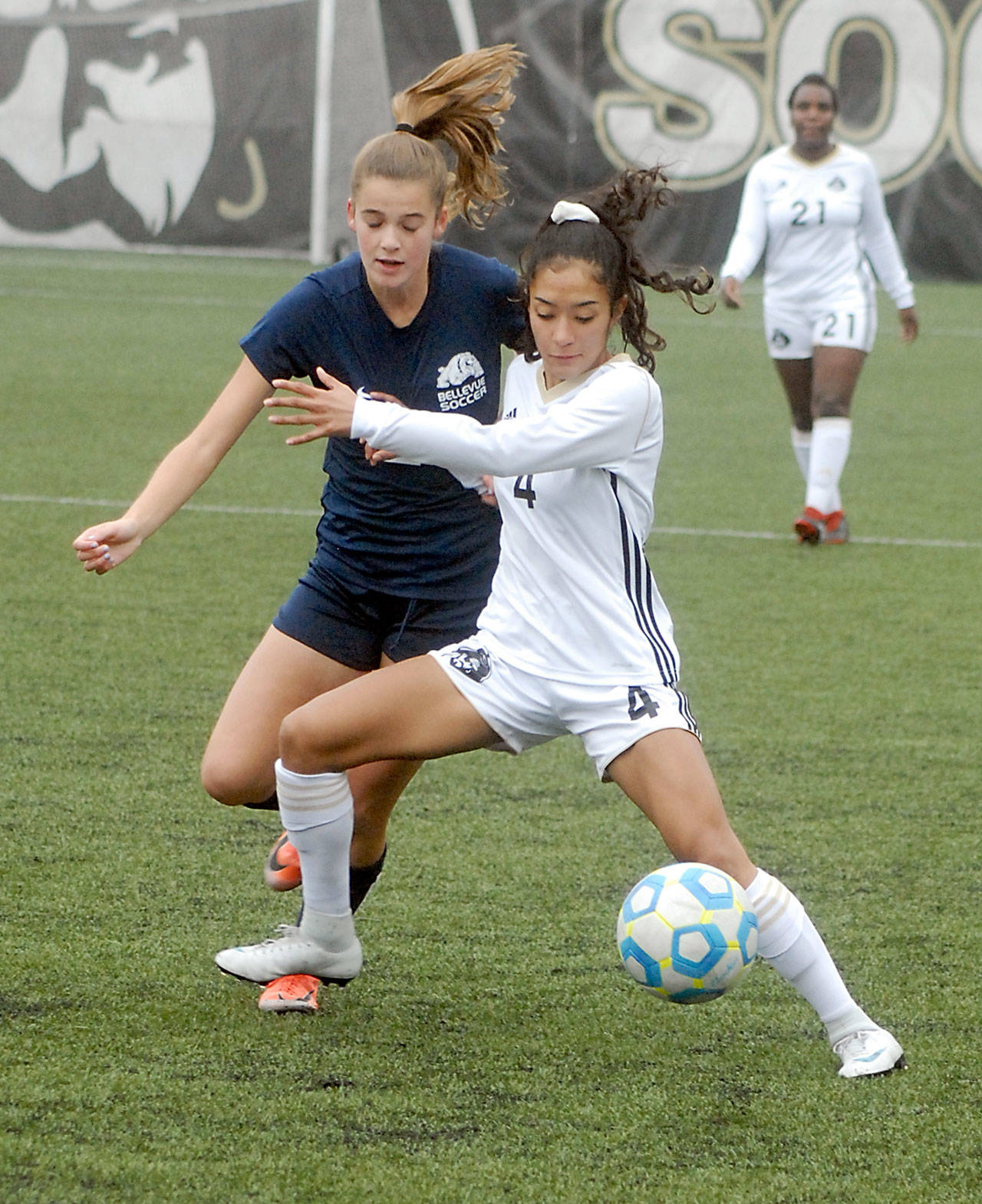 Keith Thorpe/Peninsula Daily News Peninsulas Zahori Toledo, front, fends off Bellevues Teaghen Sweckard during Saturdays NWAC Quarterfinal playoff match at Wally Sigmar Field in Port Angeles.