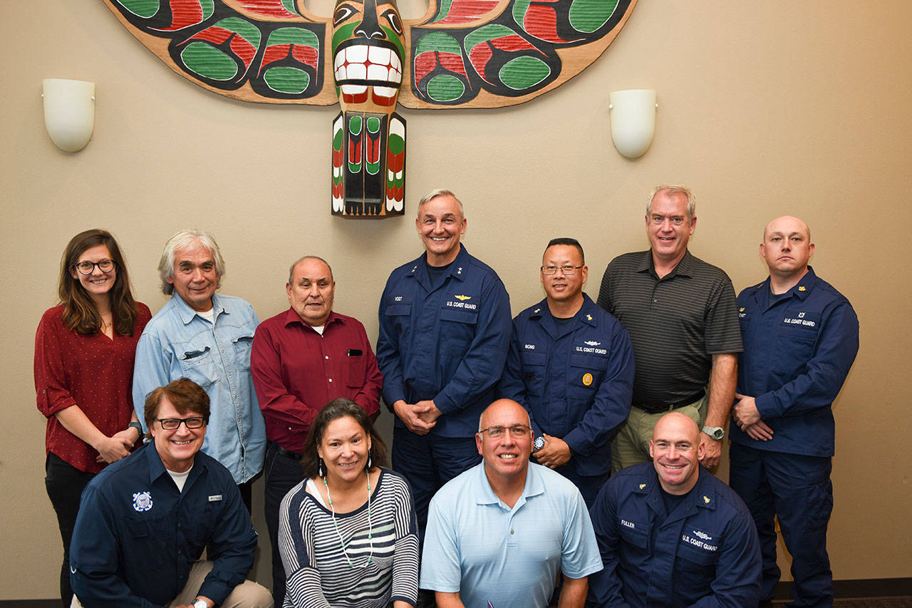 The members of the Makah Tribe and Coast Guard included, from left, back row, Haley Kennard, environmental policy analyst; Chad Bowechop, Makah Office of Marine Affairs manager; John Ides Sr., Makah Tribe chairman; Vogt; Master Chief Jason Wong; Andy Connor, Coast Guard tribal affairs chief; and Chief Warrant Officer Timothy Crochet, commanding officer of Station Neah Bay; and front row, Robert McFarland, Coast Guard incident management advisor; Carol Reamer, Office of Marine Affairs coordinator; Michael Lawrence, former Makah Tribe chairman and current Makah dock manager; and Chief Troy Fuller, executive officer of Station Neah Bay. (Petty Officer Steve Strohmaier)
