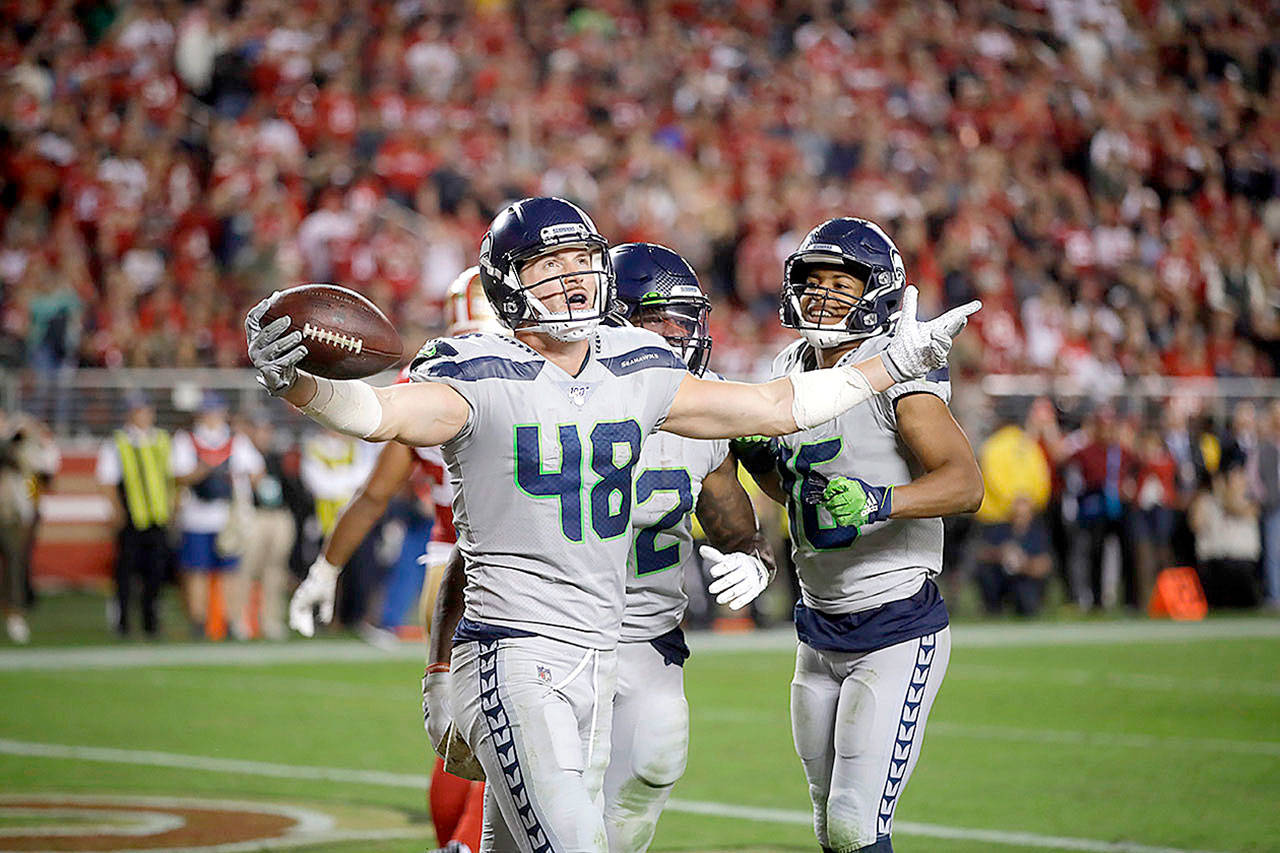 Seattle Seahawks tight end Jacob Hollister (48) celebrates after scoring against the San Francisco 49ers on Monday in Santa Clara, Calif., Monday.