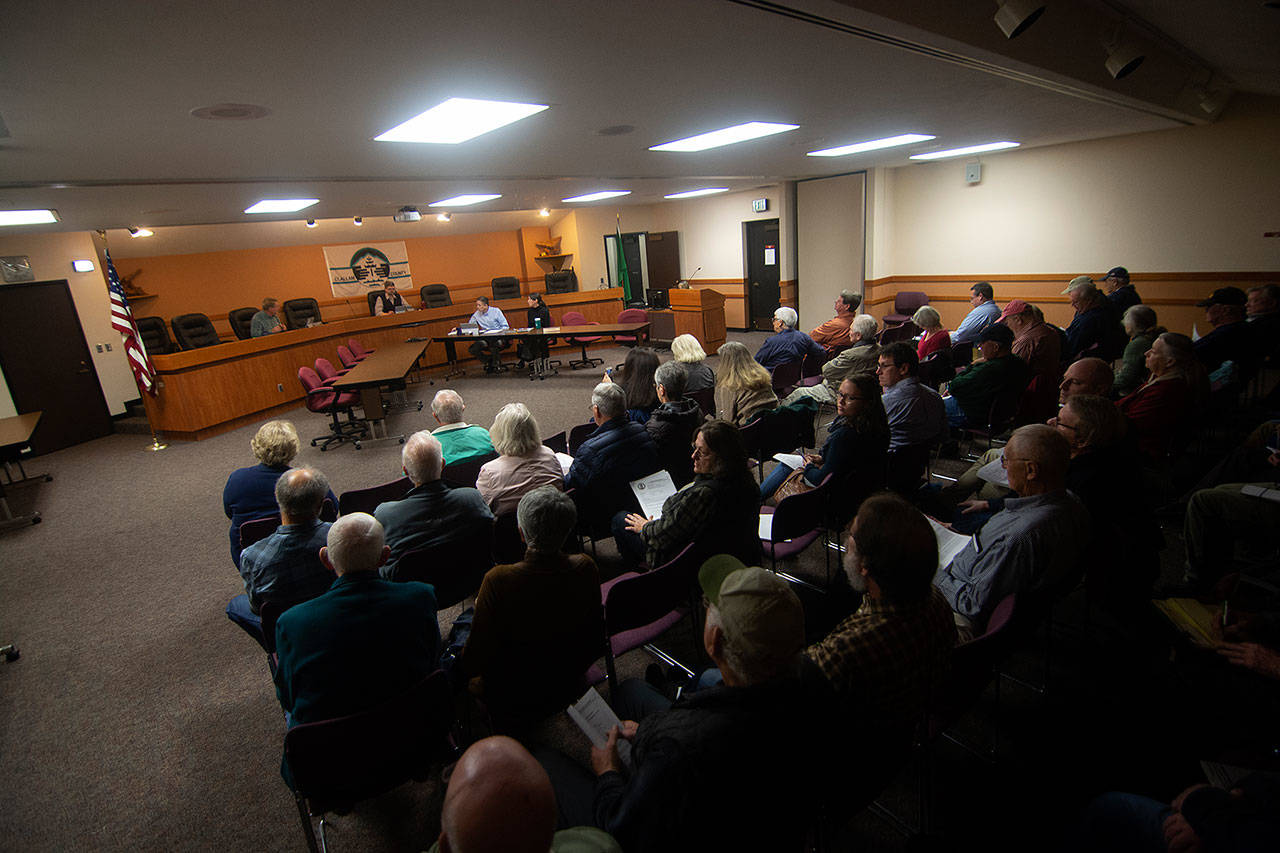People packed into the Clallam County commissioners’ chambers Tuesday to have their say on a proposed property tax that aims to protect farmland. (Jesse Major/Peninsula Daily News)