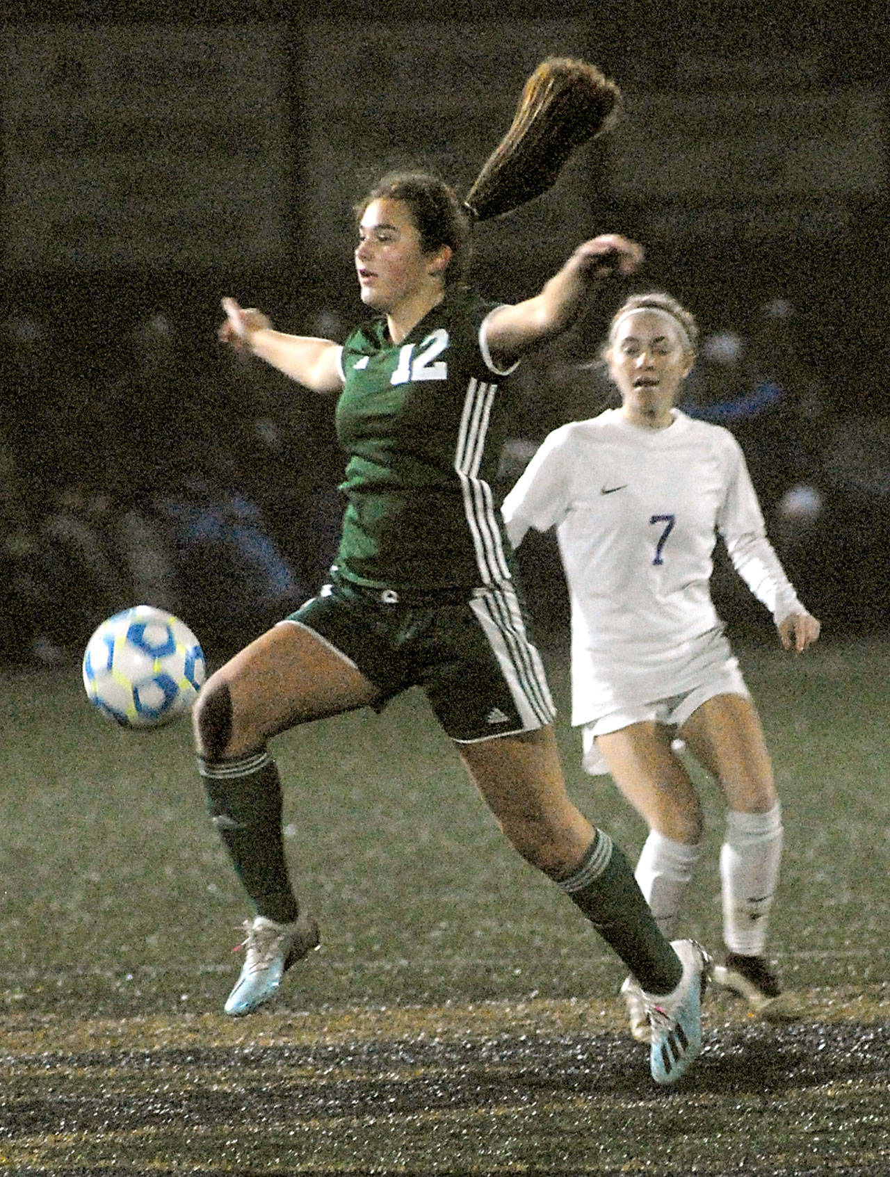 Port Angeles’ Eve Burke controls the ball in front of Sequims Daisy Ryan during a district playoff game at Peninsula College. (Keith Thorpe/Peninsula Daily News)
