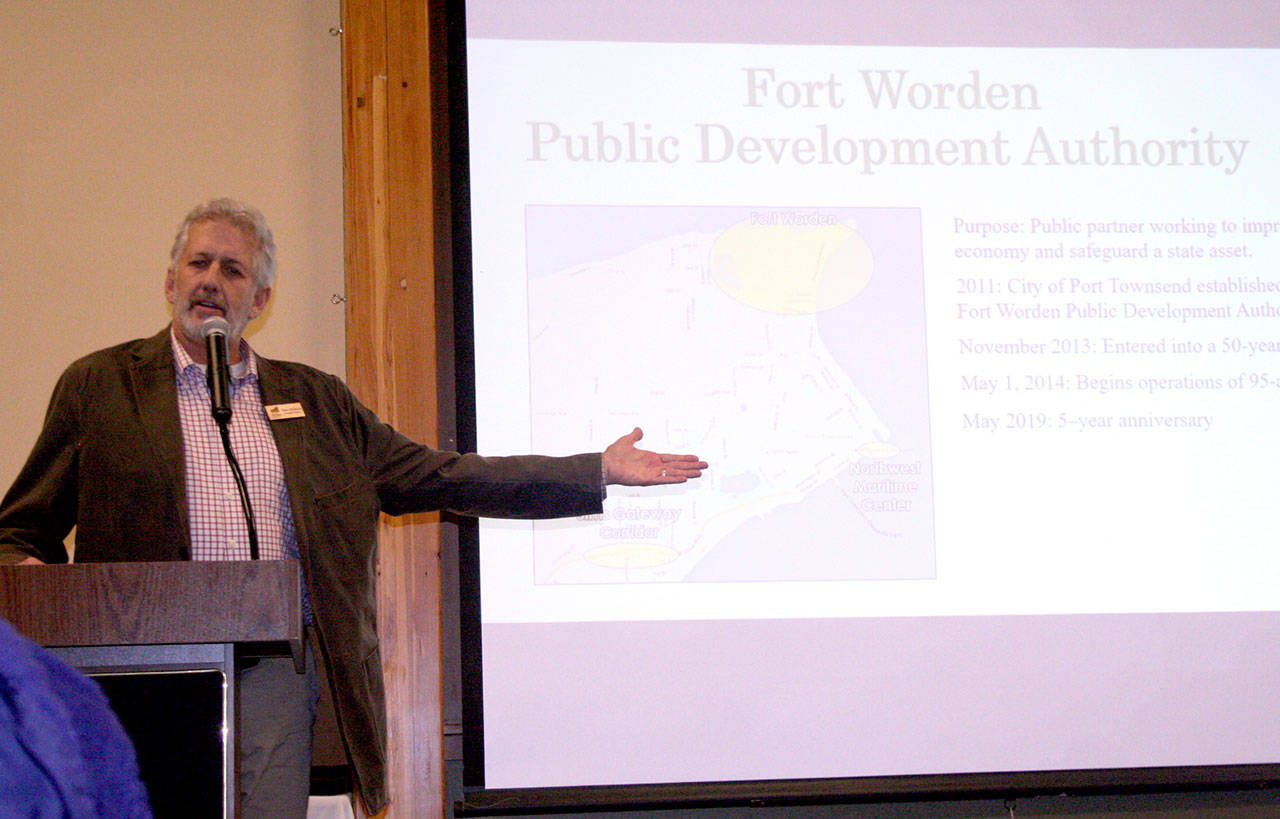 Dave Robison, the executive director of the Fort Worden Public Development Authority, provides a history of the grounds Monday during a luncheon hosted by the Chamber of Jefferson County at the Fort Worden Commons. (Brian McLean/Peninsula Daily News)