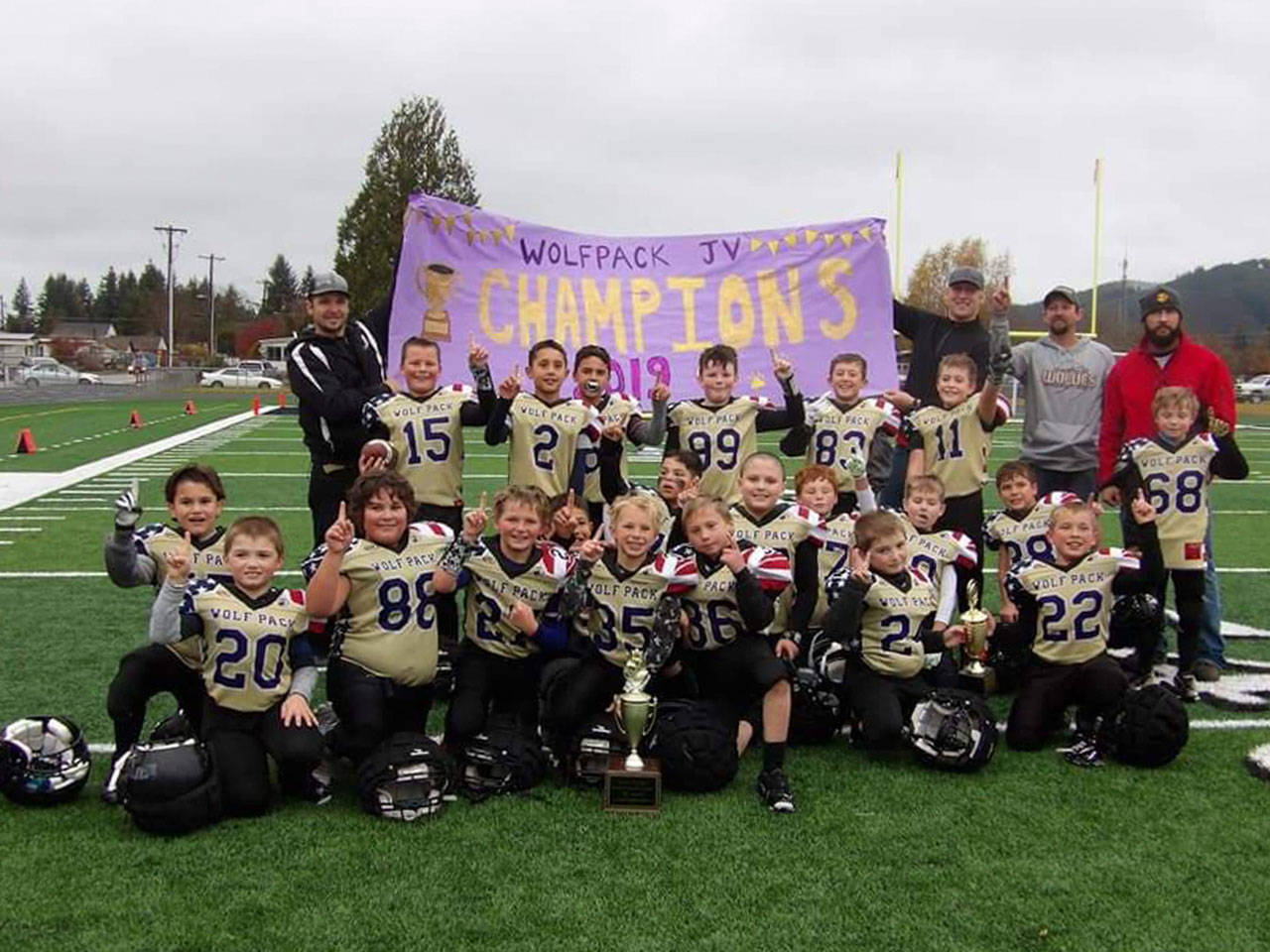 The Sequim Wolf Pack junior varsity squad won the North Olympic Youth Football League B-Squad Championship with a 13-12 triumph against the Port Angeles Future Riders in Forks on Nov. 9. Sequim quarterback Kaden Miller threw two touchdown passes, both to Nolan Bacchus. Miller also ran in an extra-point-after-touchdown to give Sequim the win. (Submitted photo)