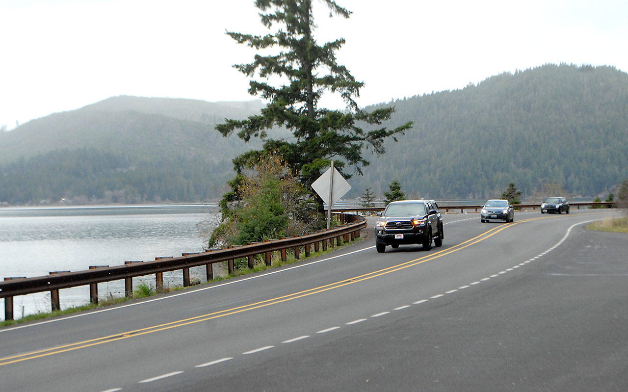Traffic makes its way along a newly resurfaced section of U.S. Highway 101 around Sledge Hammer Point at Lake Crescent in Olympic National Park. (Keith Thorpe/Peninsula Daily News)