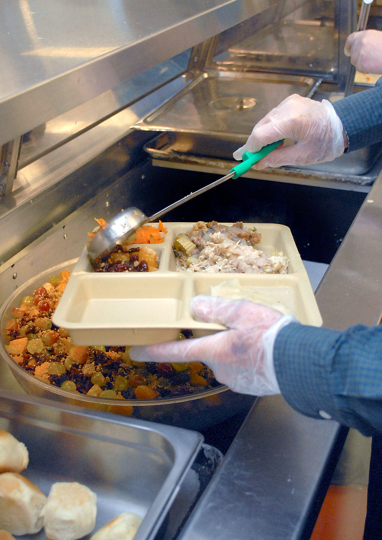 A meal is prepared for participants in Wednesday’s Thanksgiving Eve lunch at the Salvation Army in Port Angeles. (Keith Thorpe/Peninsula Daily News)