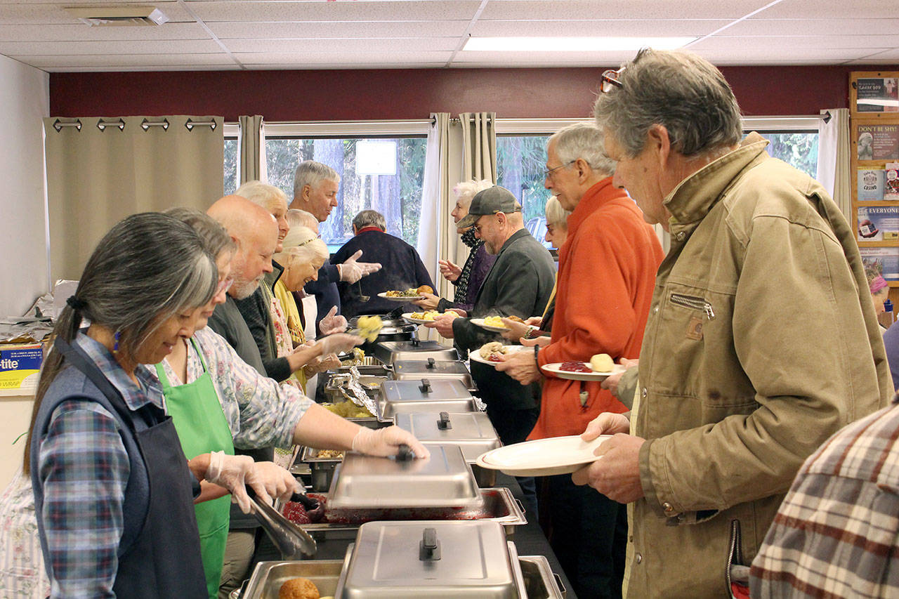 A team of more than 80 volunteers helped serve the attendees of the Tri Area Community Meals Thanksgiving Dinner at the Tri Area Community Center on Thursday afternoon. (Zach Jablonski/Peninsula Daily News)