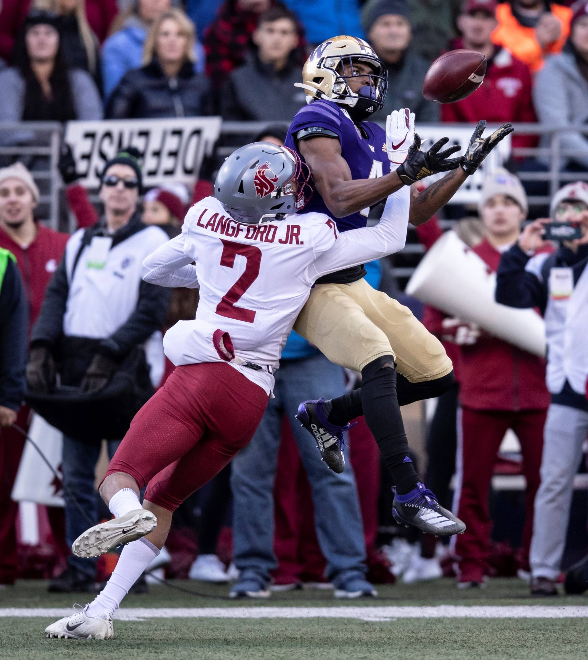 Washington State cornerback Derrick Langford, left, breaks up a pass intended for Washington wide receiver Terrell Bynum during the first half of an NCAA college football game, on Friday, Nov. 29, 2019 in Seattle. (AP Photo/Stephen Brashear)