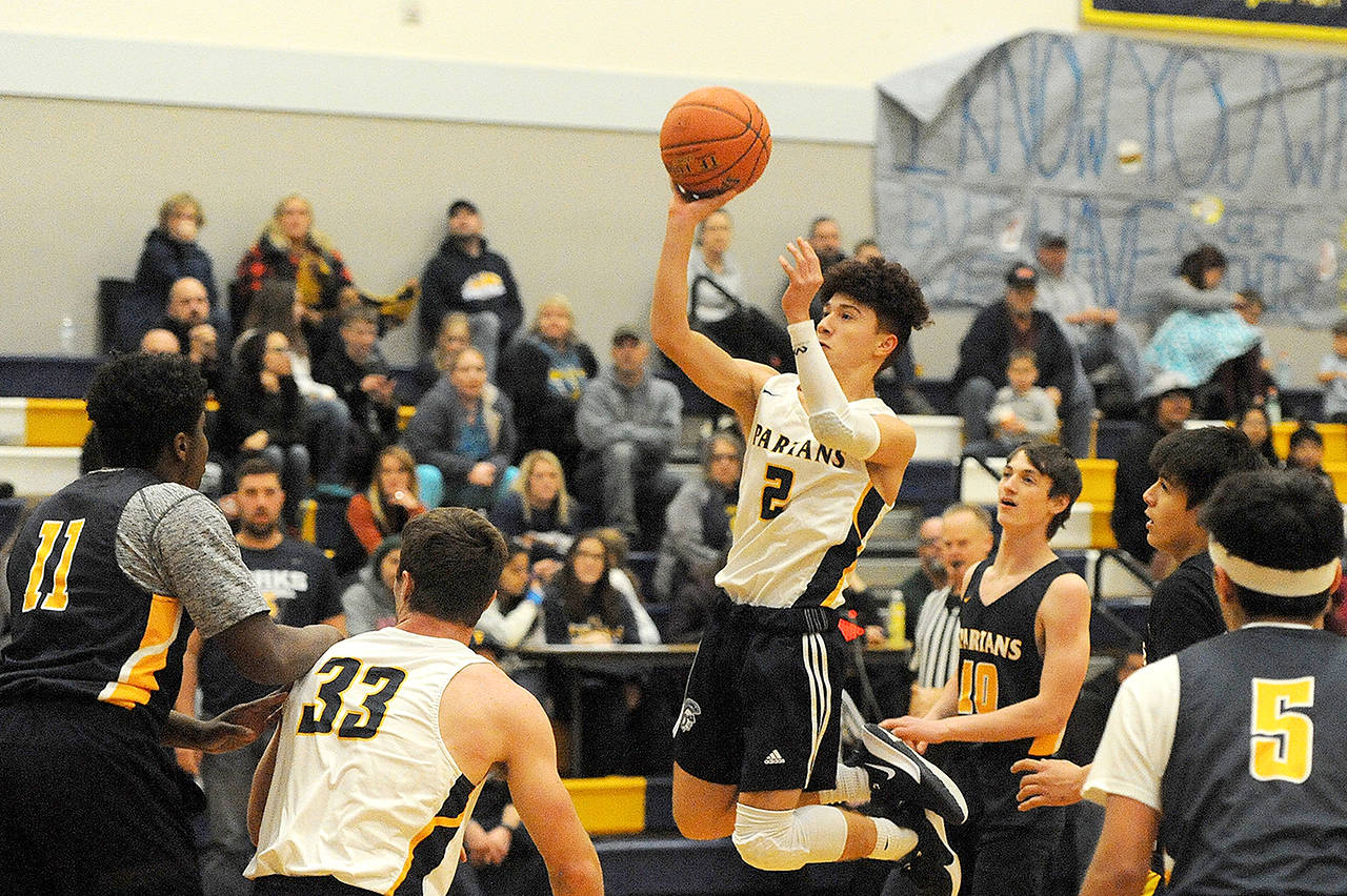 Forks’ Oscar Gonzalez puts up a shot during the team’s Blue and Gold Scrimmage. (Lonnie Archibald/for Peninsula Daily News)