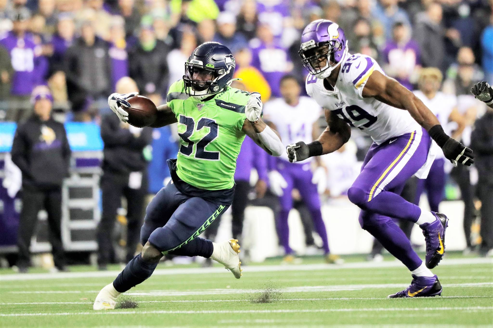 Seattle Seahawks’ Chris Carson runs on a 26-yard carry as Minnesota Vikings’ Danielle Hunter pursues during the second half of an NFL football game, Monday, Dec. 2, 2019, in Seattle. (AP Photo/Ted S. Warren)