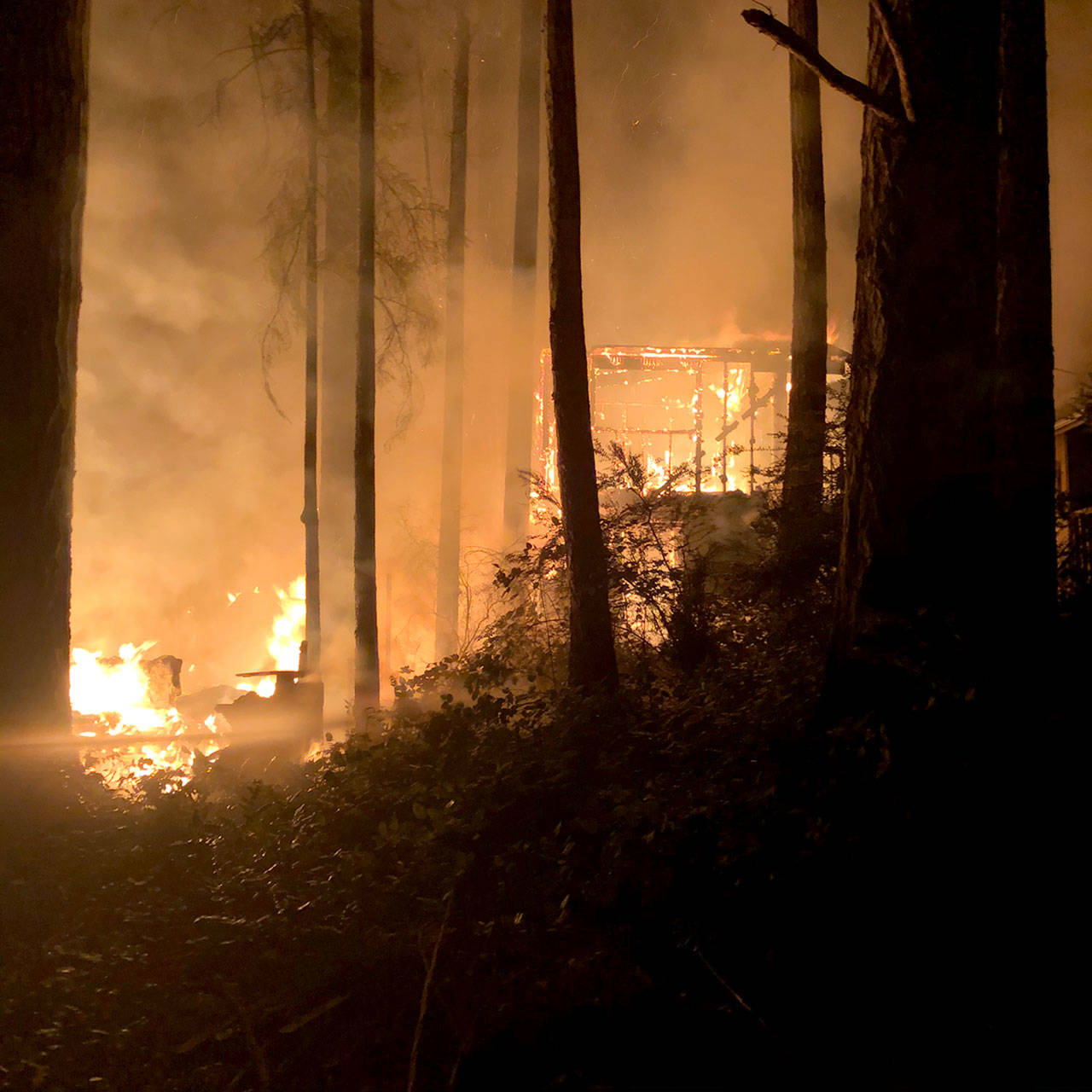 Firefighters work to put out a fire on Alder Street in Coyle on Monday night. (Jefferson County Sheriff’s Office)