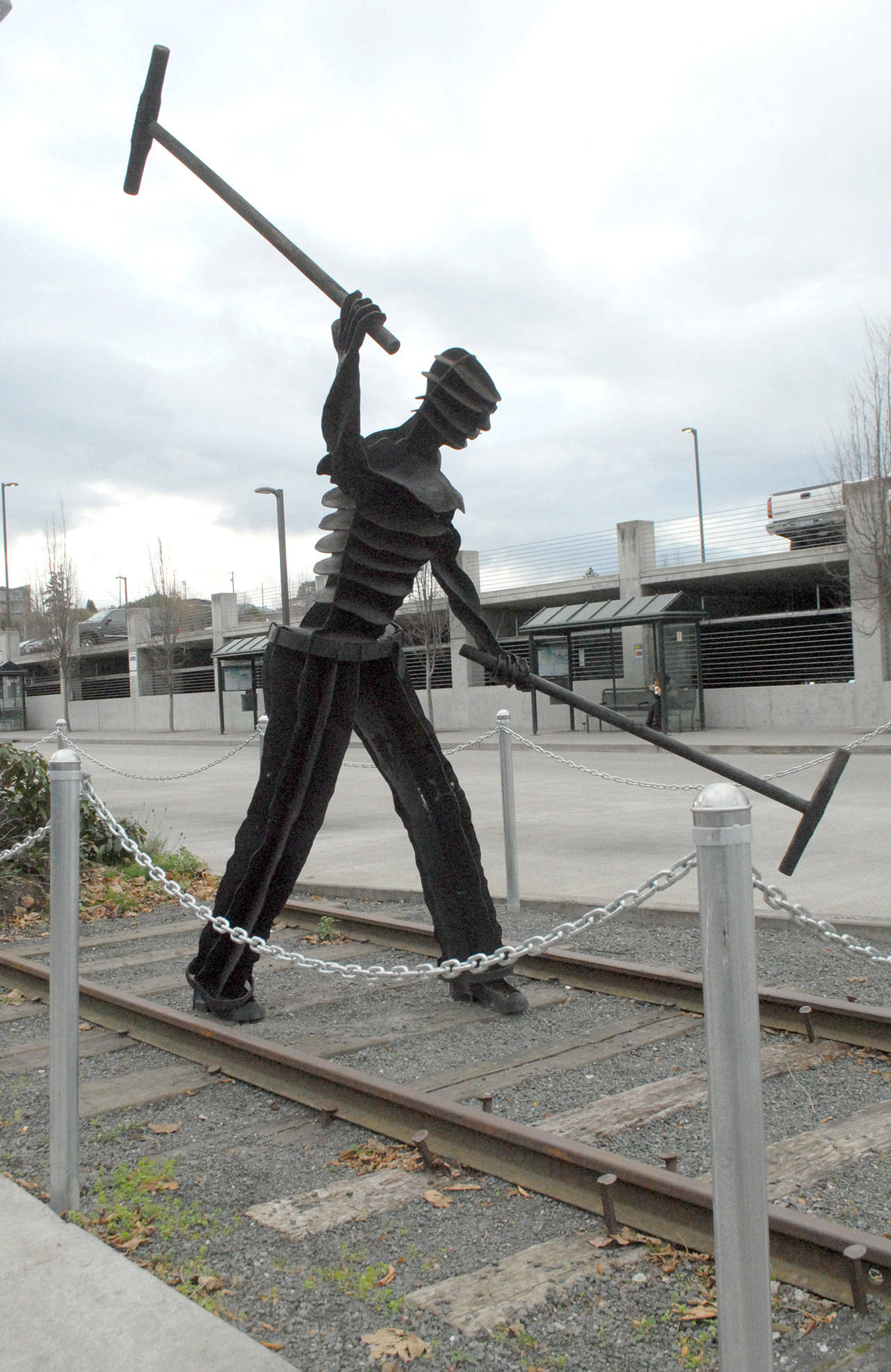 The sculpture “Gandy Dancer” by artist Jim Mattern stands at its current location at The Gateway transit center in downtown Port Angeles after being displaced twice since its acquisition in 2003. (Keith Thorpe/Peninsula Daily News)