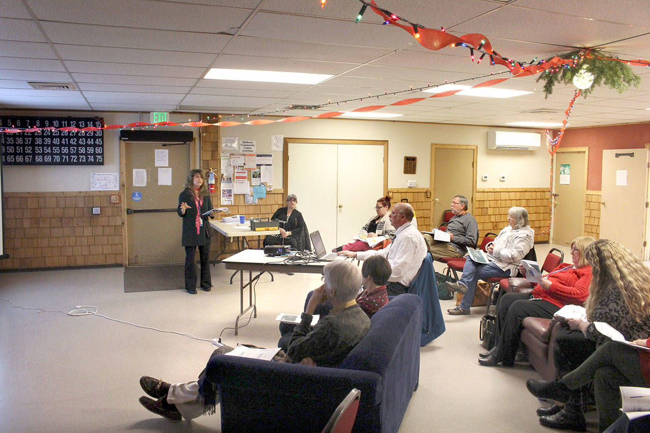 Community Health Improvement Plan Co-Executive Director Lori Flemming presents the summary of findings of the Community Health Assessment to a group of about a dozen people at the Quilcene Community Center on Wednesday. (Zach Jablonski/Peninsula Daily News)