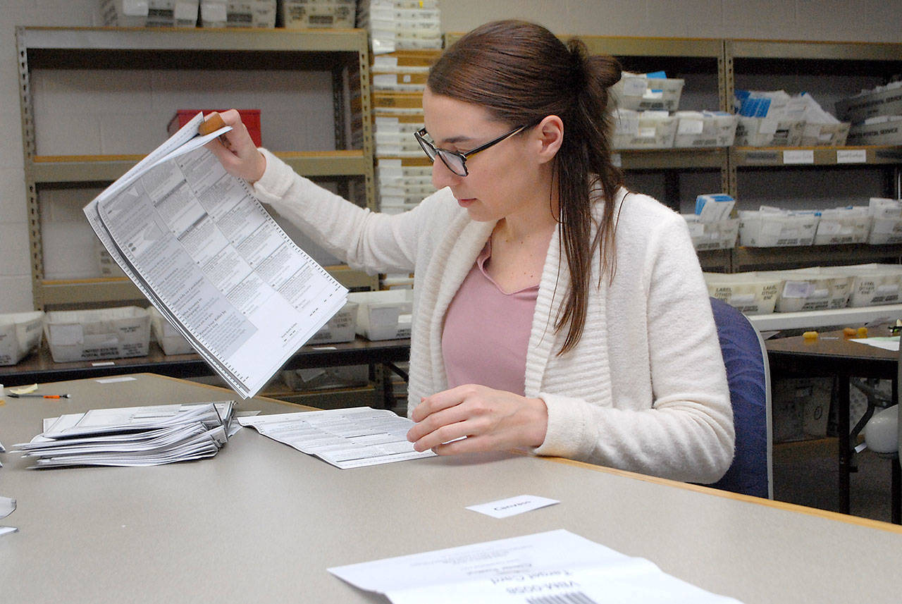 Clallam County Elections Manager Joanne Koon sorts through ballots during Wednesdays recount at the Clallam County Courthouse to determine the outcome of a Port Angeles City Council seat race. (Keith Thorpe/Peninsula Daily News)