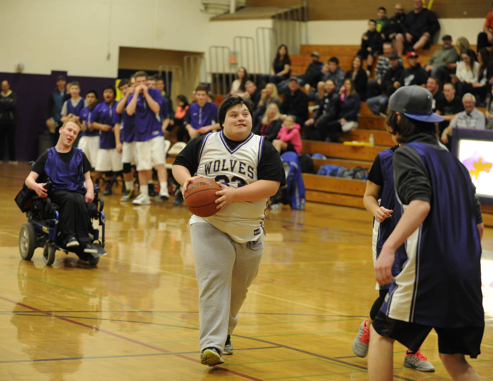 Nick Barrett and other Sequim High School students take part in the school’s first Unified Basketball game in January 2016. Unified is an offshoot of Special Olympics, a program where athletes and partners work together to create a team experience for all. (Michael Dashiell/Olympic Peninsula News Group)
