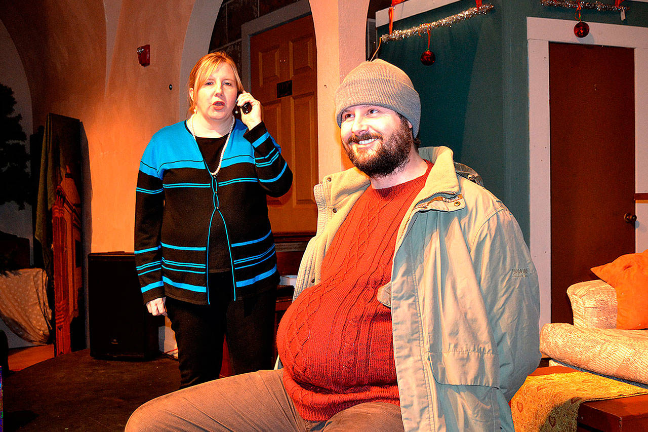 Karol (Christy Holy) calls the police on “the Guy” (E.J. Anderson III) as she discovers him in her house for “Another Night Before Christmas.” Through odd fate, the two are stuck together throughout the musical. (Matthew Nash/Olympic Peninsula News Group)