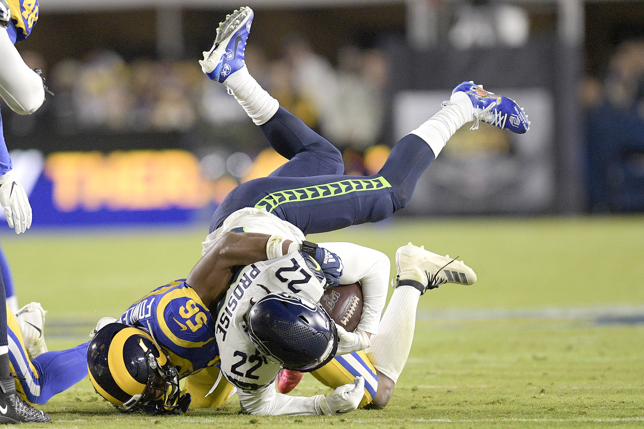 Los Angeles Rams linebacker Dante Fowler, left, tackles Seattle Seahawks running back C.J. Prosise during the Rams’ 28-12 win over Seattle. (The Associated Press)